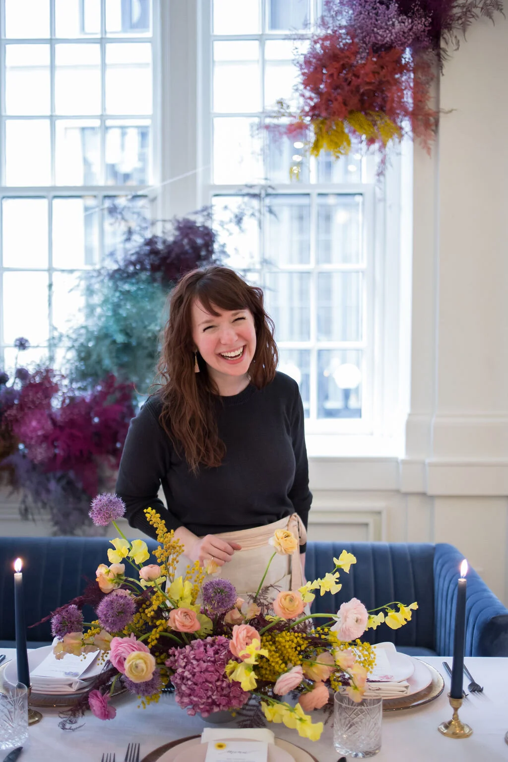 Rainbow colored floral installation with painted and dyed baby’s breath and plums ferns. Modern, minimal, colorful wedding flowers at the Noelle Hotel in downtown Nashville.