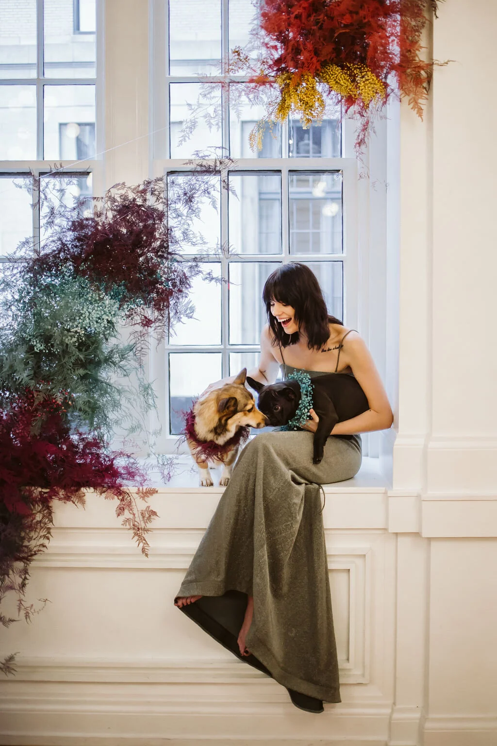 Rainbow colored floral installation with painted and dyed baby’s breath and plums ferns. Modern, minimal, colorful wedding flowers at the Noelle Hotel in downtown Nashville. Colorful dog flower wreaths for a corgie and a frenchie.