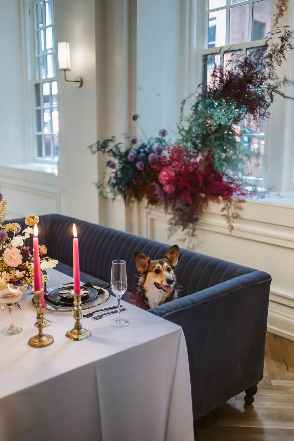 Rainbow colored floral installation with painted and dyed baby’s breath and plums ferns. Modern, minimal, colorful wedding flowers at the Noelle Hotel in downtown Nashville.