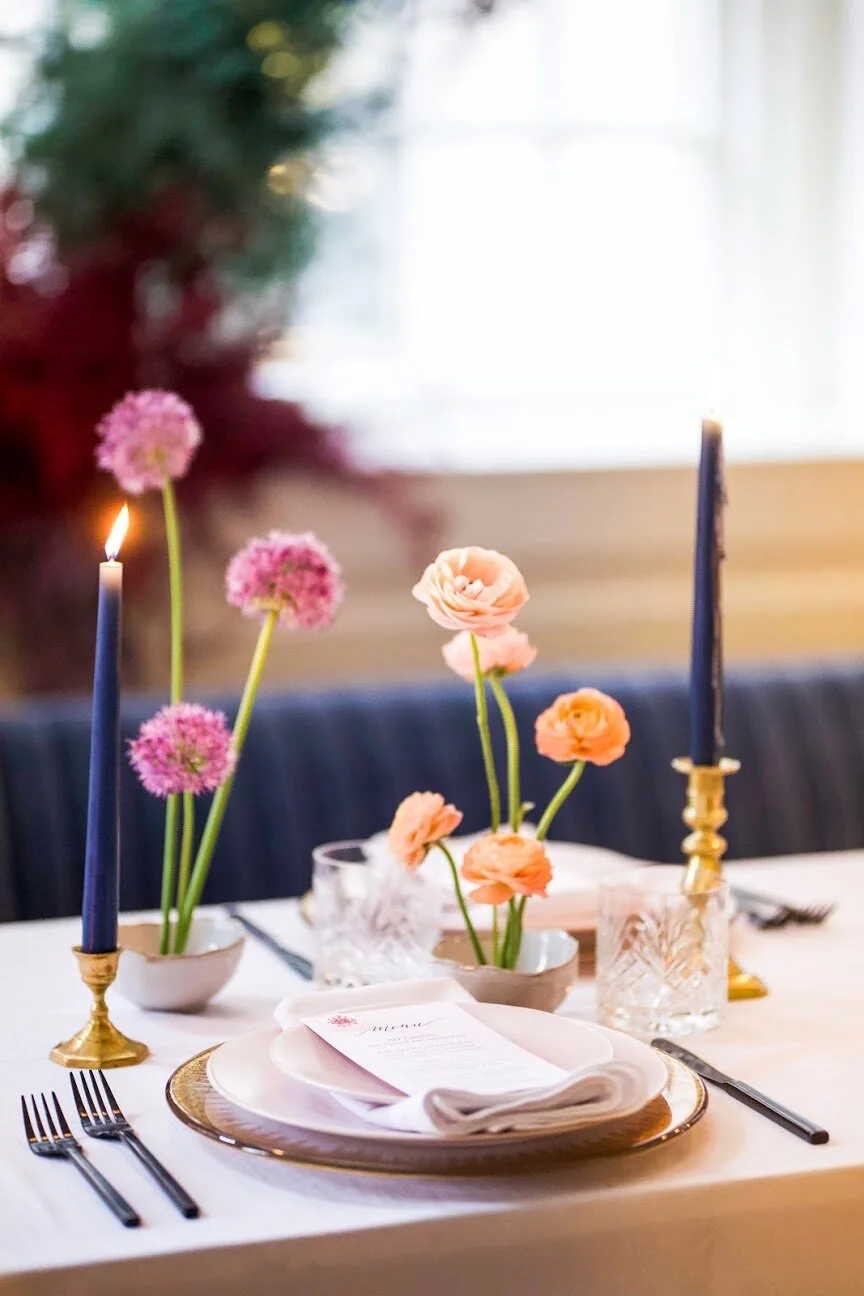 Minimal, modern ikebana centerpieces with purple allium and peach ranunculus. Nashville wedding floral design at the Noelle Hotel.