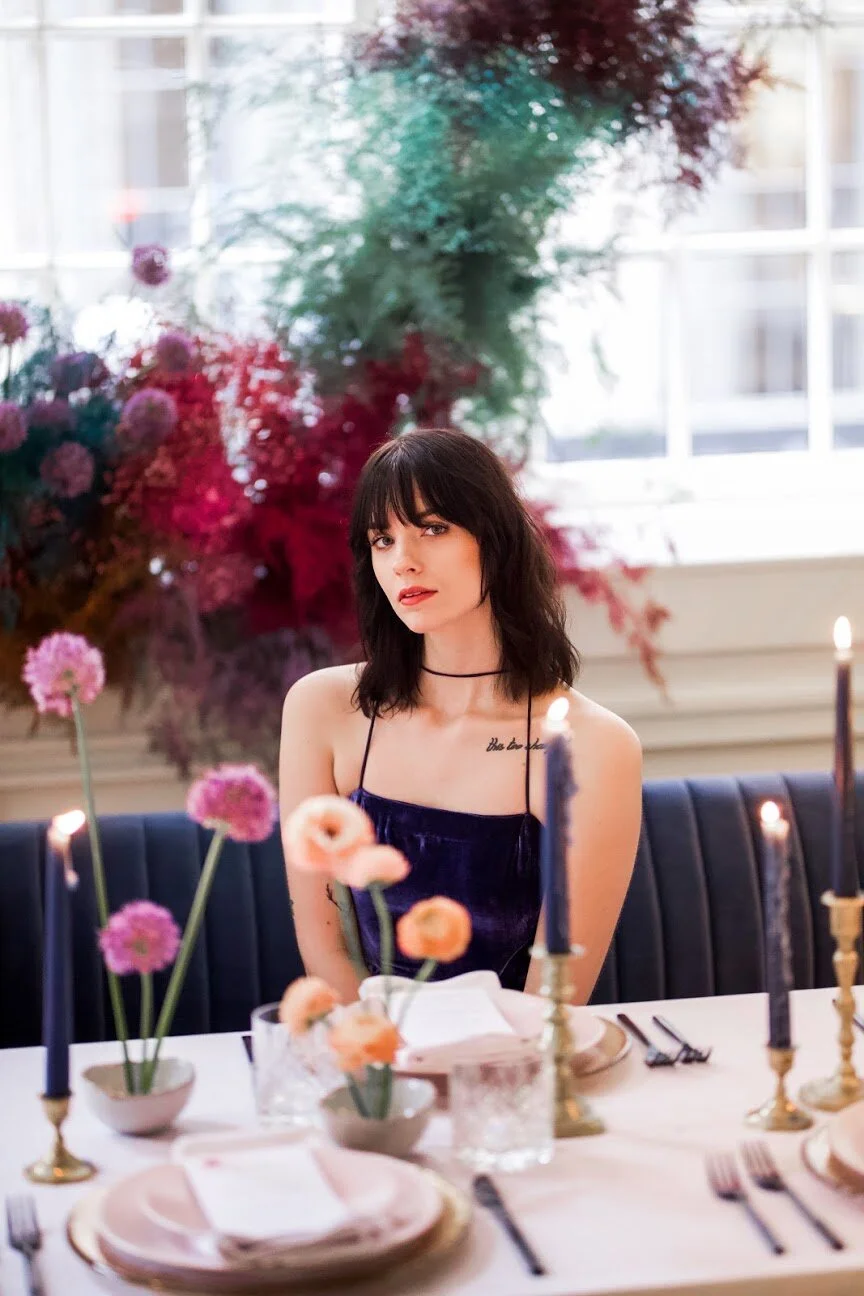 Minimal, modern ikebana centerpieces with purple allium and peach ranunculus. Nashville wedding floral design at the Noelle Hotel.