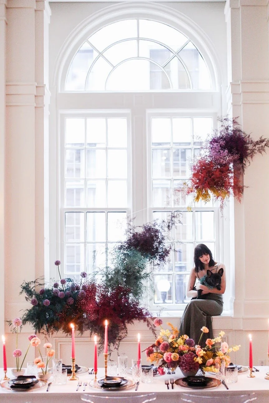 Rainbow colored floral installation with painted and dyed baby’s breath and plums ferns. Modern, minimal, colorful wedding flowers at the Noelle Hotel in downtown Nashville.