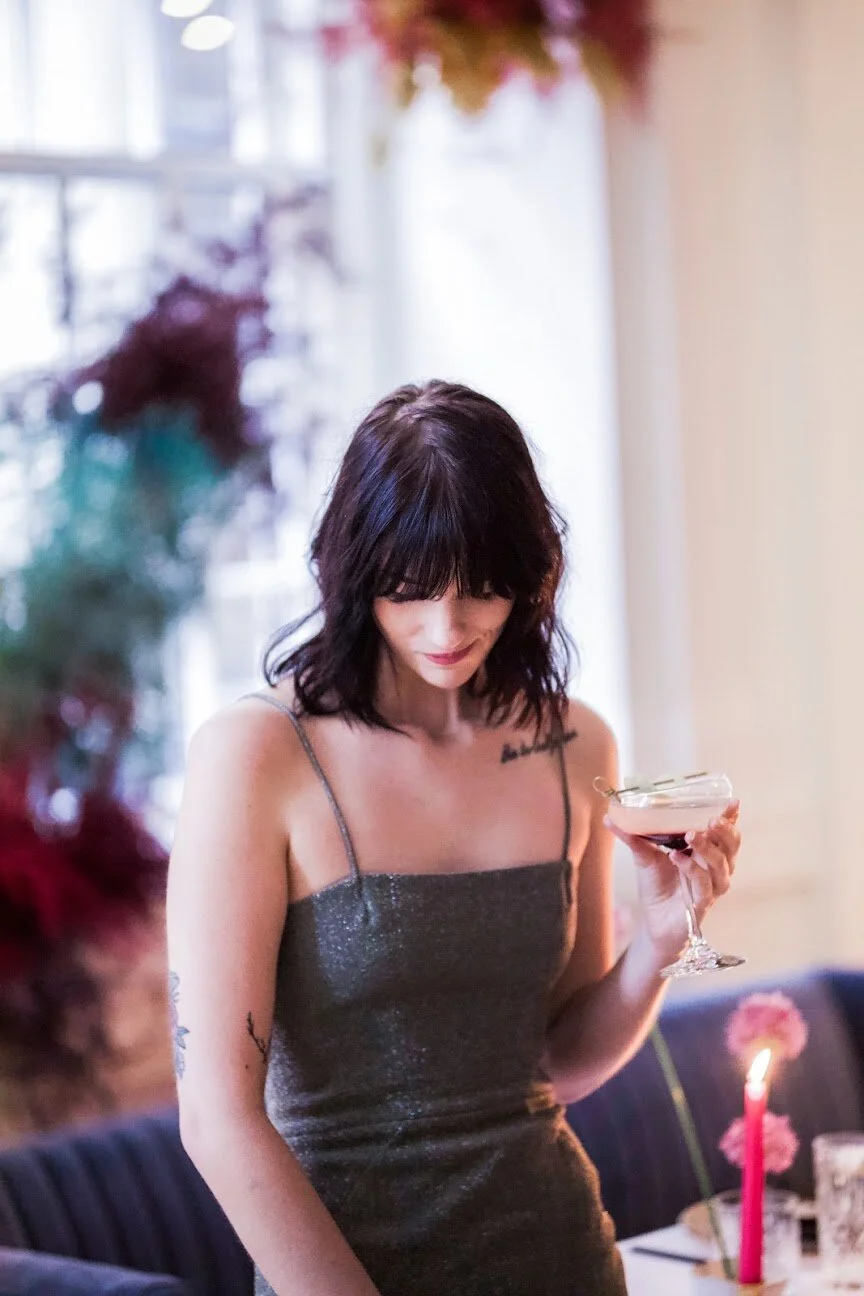 Rainbow colored floral installation with painted and dyed baby’s breath and plums ferns. Modern, minimal, colorful wedding flowers at the Noelle Hotel in downtown Nashville.