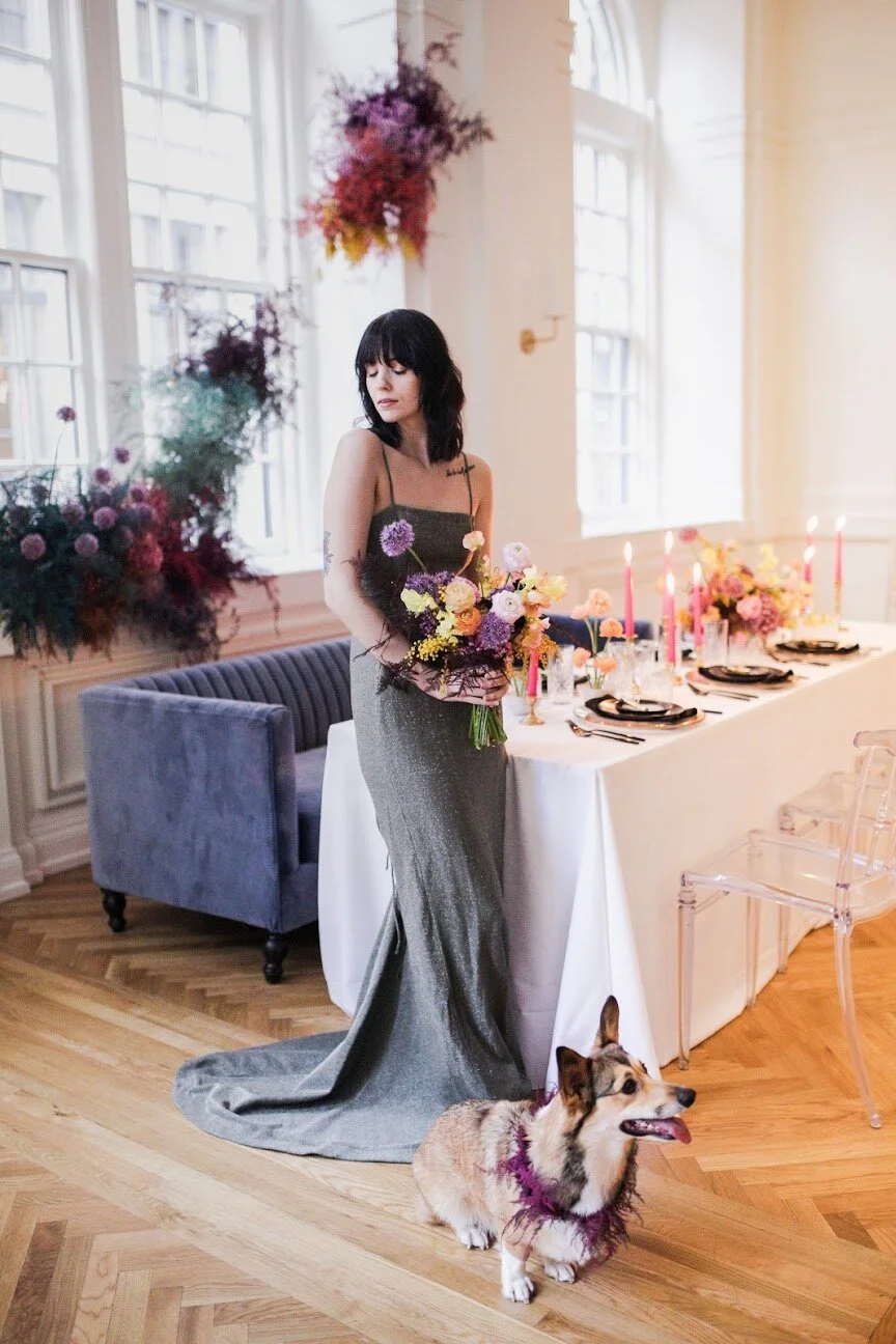 Rainbow colored floral installation with painted and dyed baby’s breath and plums ferns. Modern, minimal, colorful wedding flowers at the Noelle Hotel in downtown Nashville.