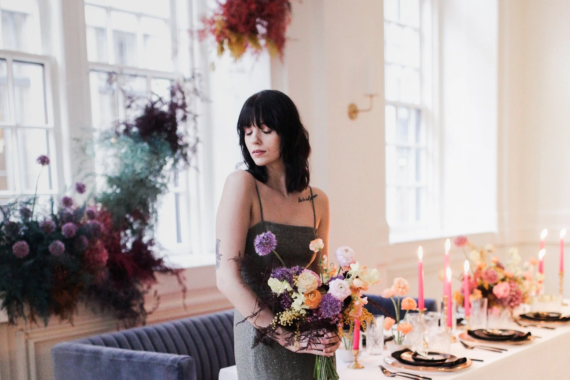 Rainbow colored floral installation with painted and dyed baby’s breath and plums ferns. Modern, minimal, colorful wedding flowers at the Noelle Hotel in downtown Nashville.