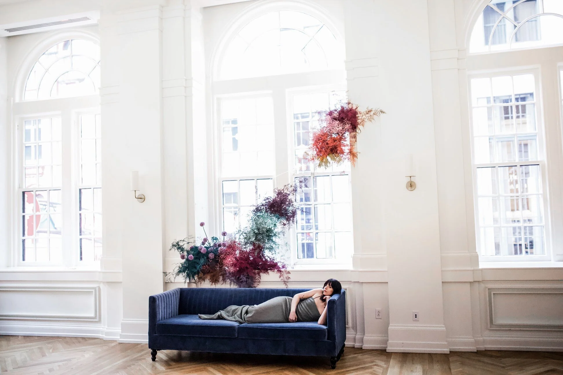 Rainbow colored floral installation with painted and dyed baby’s breath and plums ferns. Modern, minimal, colorful wedding flowers at the Noelle Hotel in downtown Nashville.