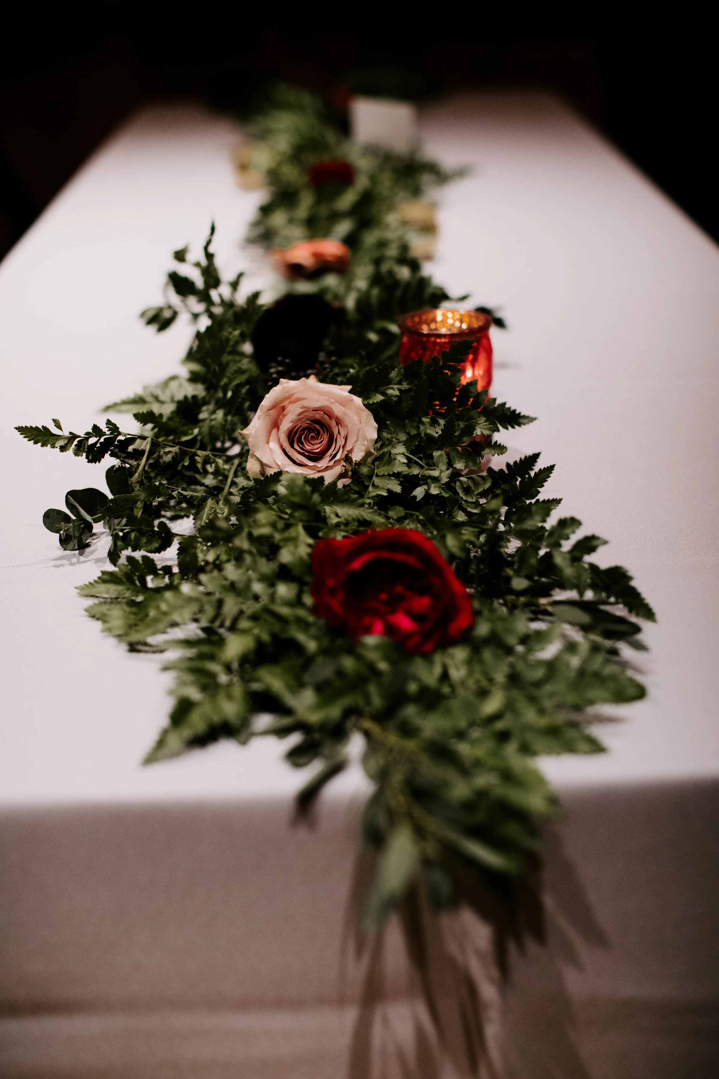 Table runner garlands of ferns and organic greenery. Nashville wedding floral design.