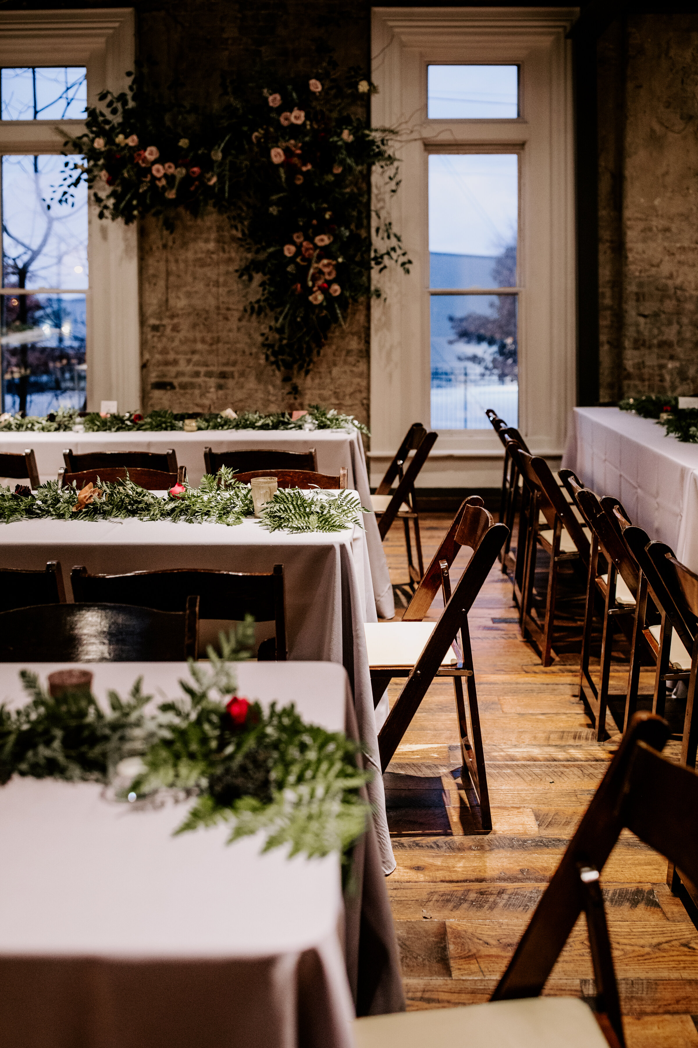 Table runner garlands of ferns and organic greenery. Nashville wedding floral design.