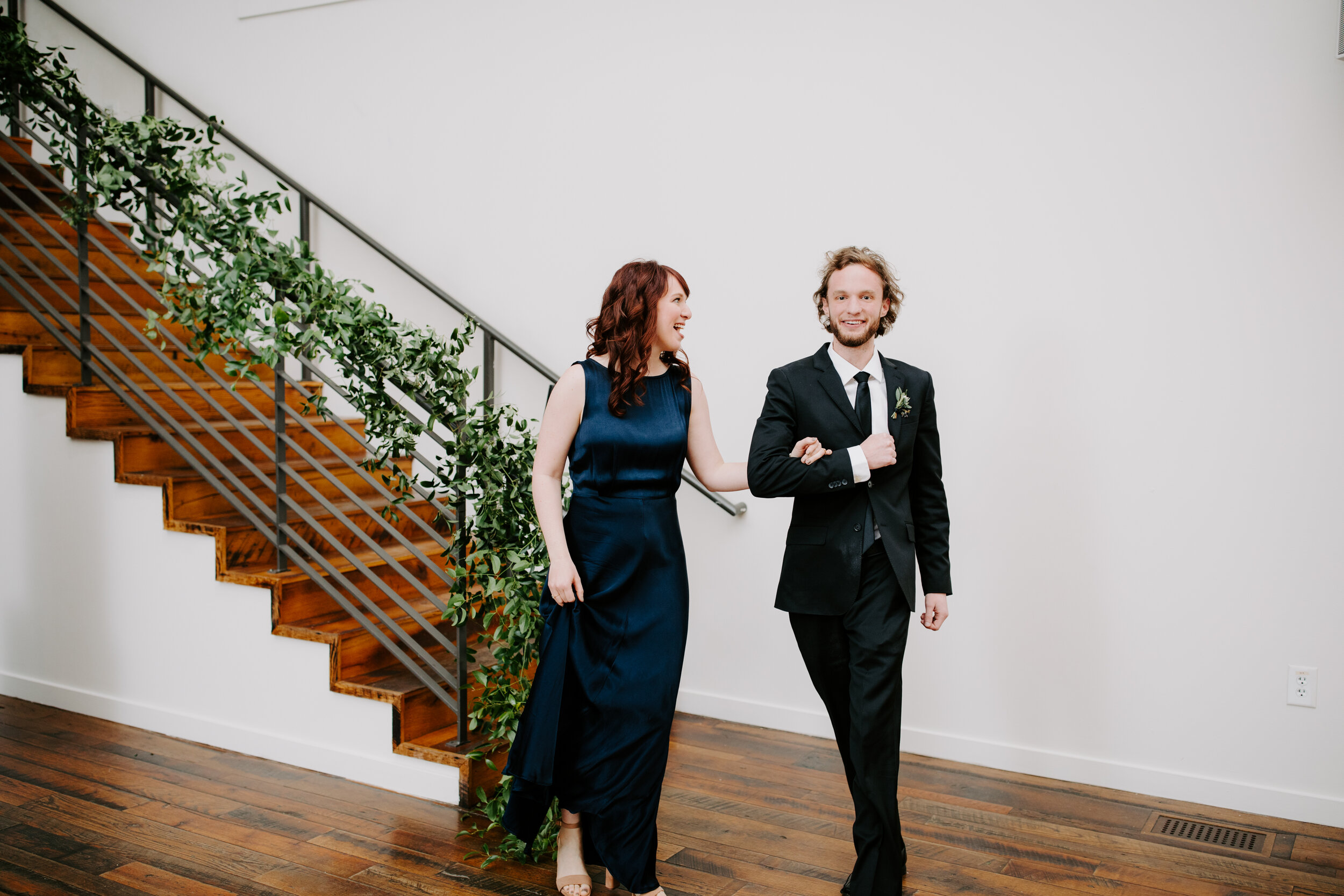 Lush greenery trailing up the staircase. Nashville wedding florist at the Cordelle.
