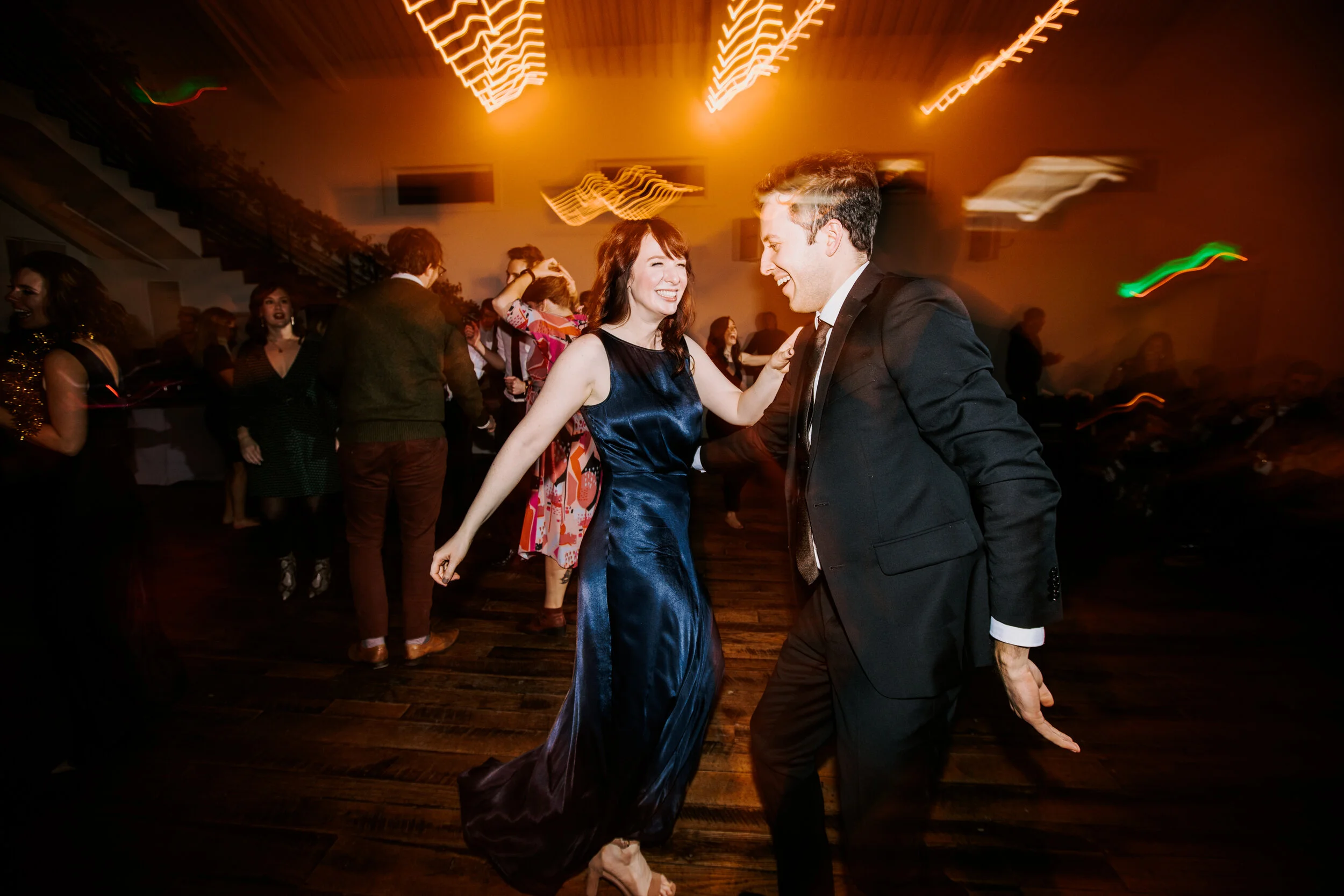 Lush greenery trailing up the staircase. Nashville wedding florist at the Cordelle.