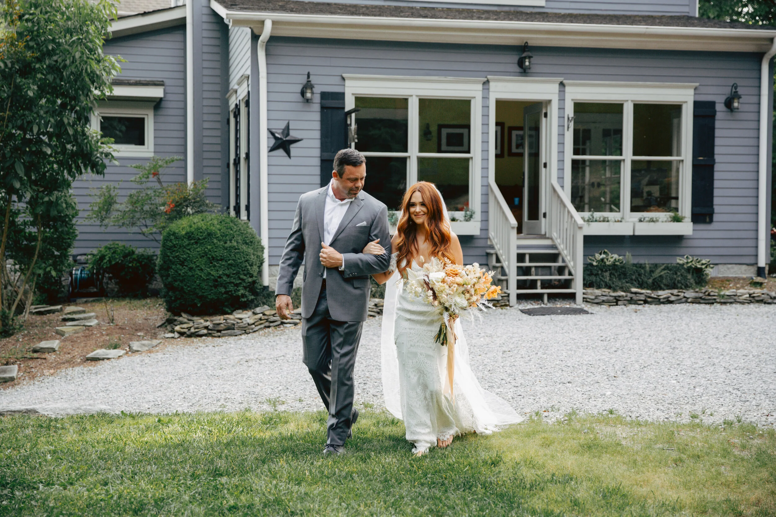 Lush, bohemian bridal bouquet with white garden roses, copper orchids, dried white ferns, earthy textures, and toffee lisianthus. Nashville wedding and elopement floral designer.