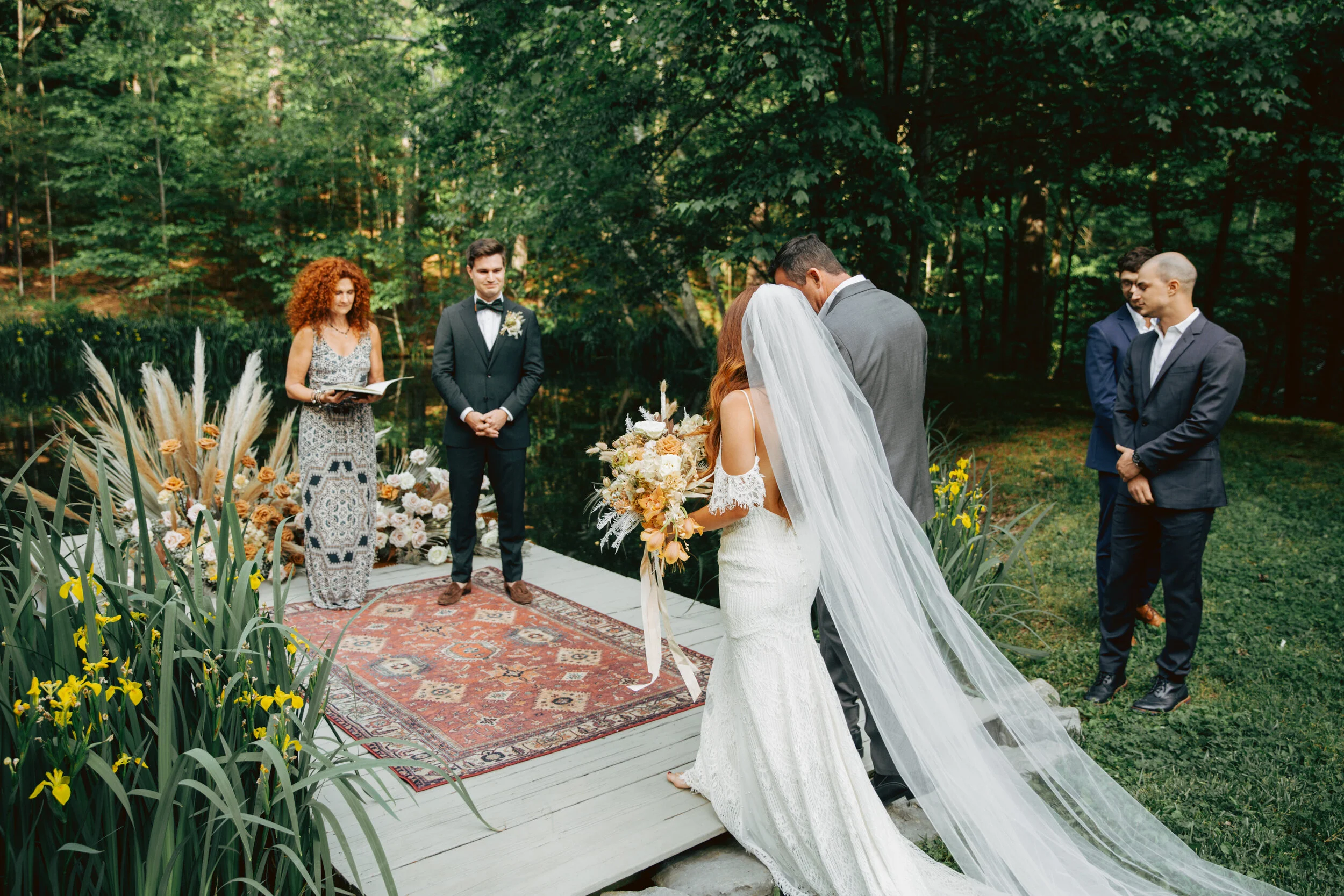 Lush, bohemian bridal bouquet with white garden roses, copper orchids, dried white ferns, earthy textures, and toffee lisianthus. Nashville wedding and elopement floral designer.