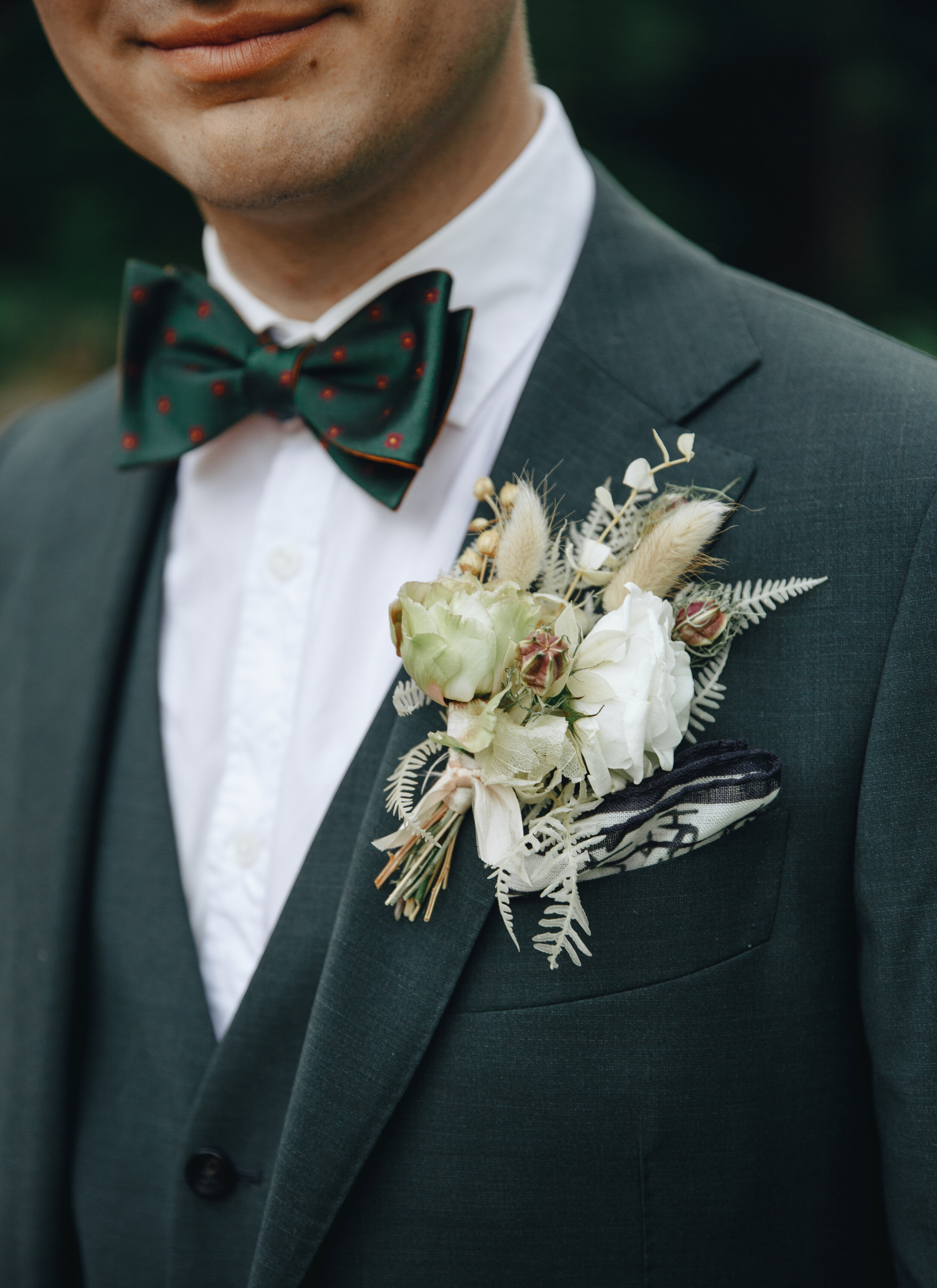 Bohemian, modern groom’s boutonniere with dried ferns and textures. Nashville wedding flowers.
