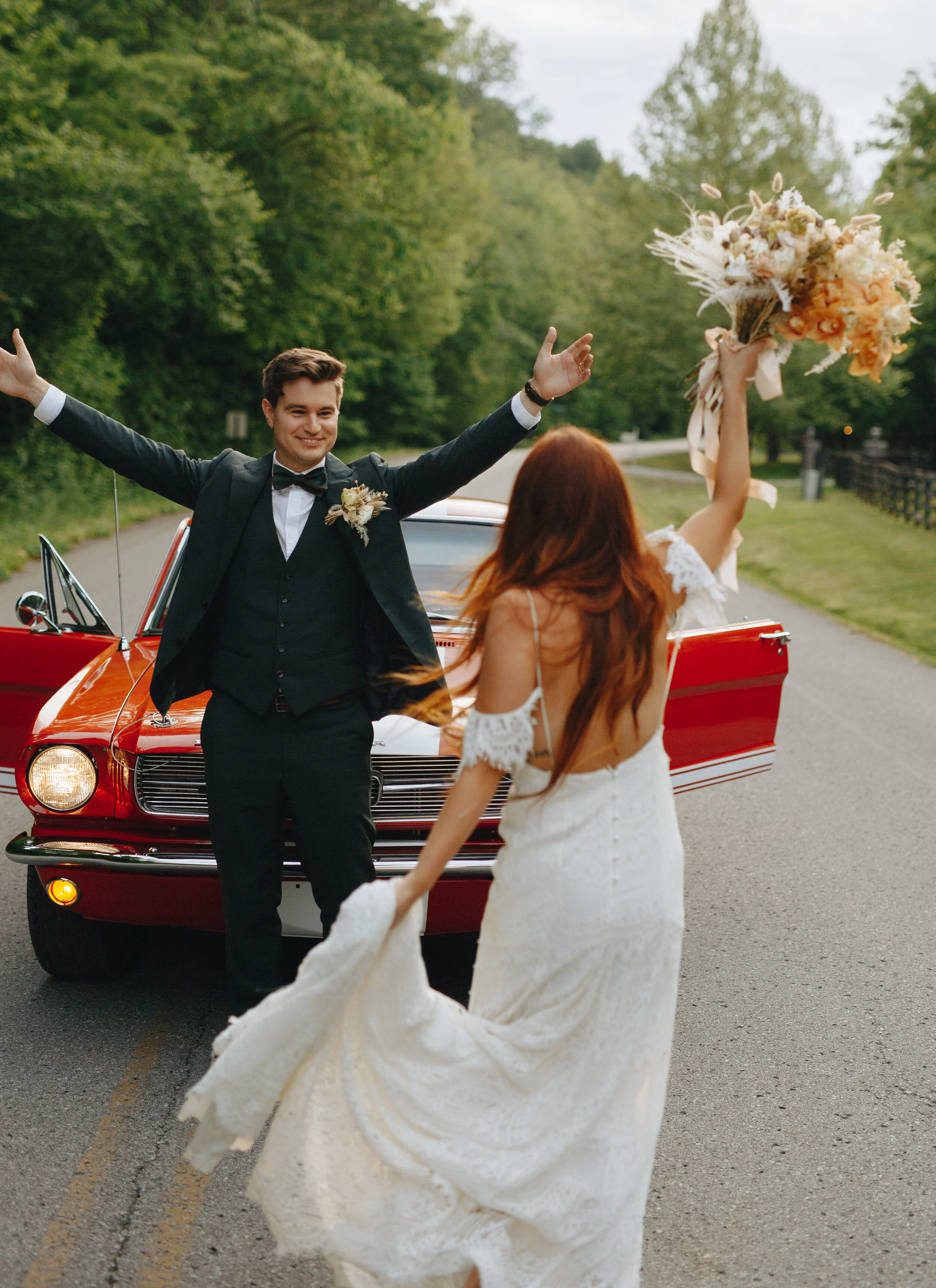 Lush, bohemian bridal bouquet with white garden roses, copper orchids, dried white ferns, earthy textures, and toffee lisianthus. Nashville wedding and elopement floral designer.