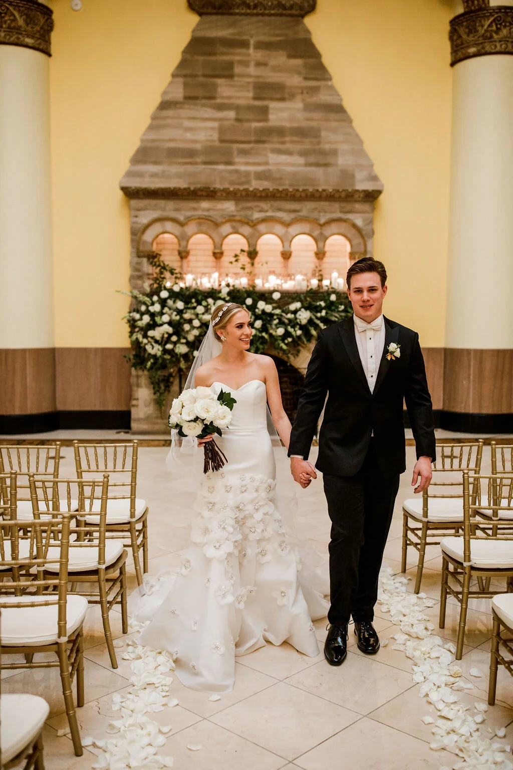 Lush fireplace mantle floral installation with all white garden roses and ranunculus with natural, untamed greenery and eucalyptus. Nashville floral designer, Rosemary & Finch, for a wedding at Union Station.