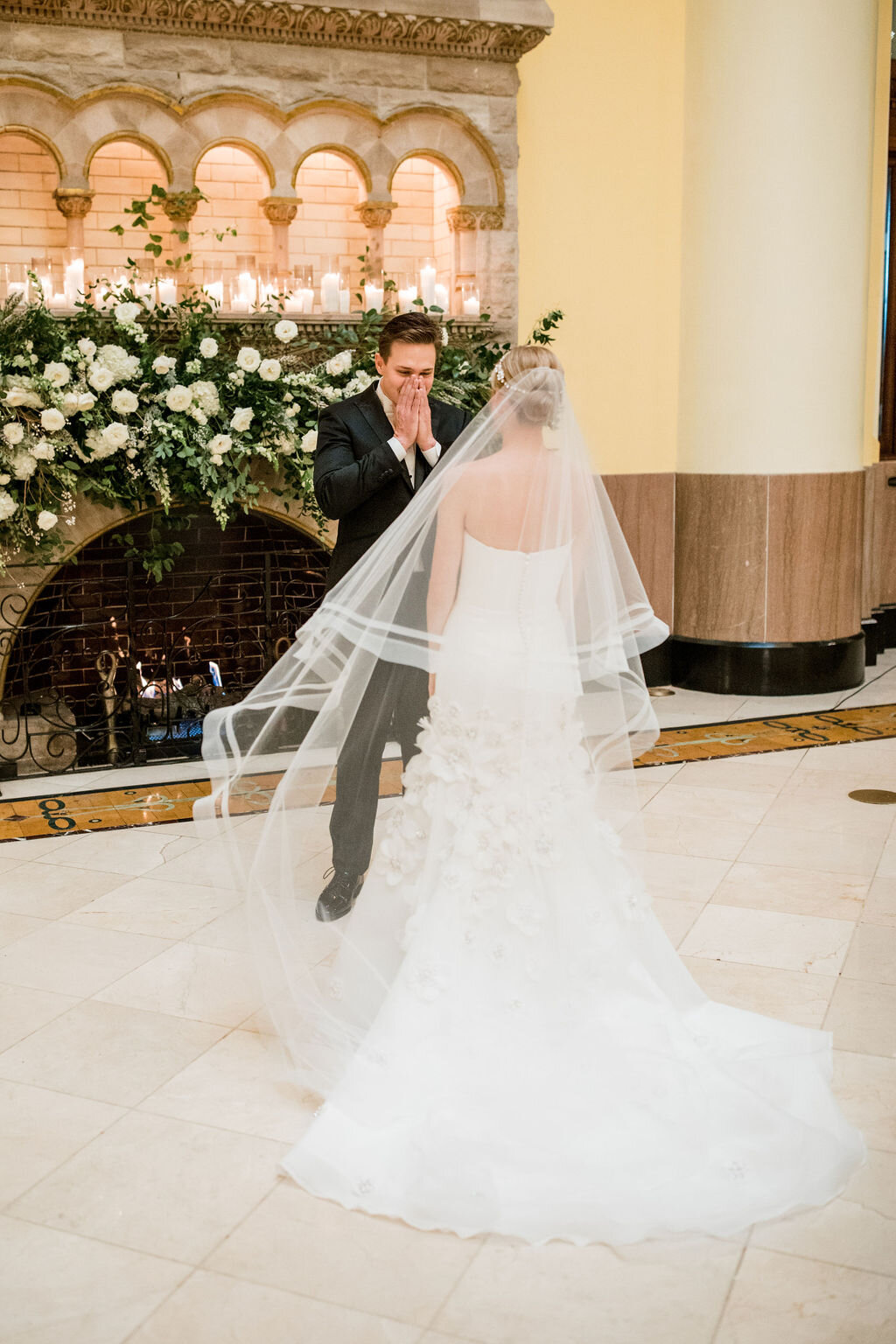Lush fireplace mantle floral installation with all white garden roses and ranunculus with natural, untamed greenery and eucalyptus. Nashville floral designer, Rosemary & Finch, for a wedding at Union Station.
