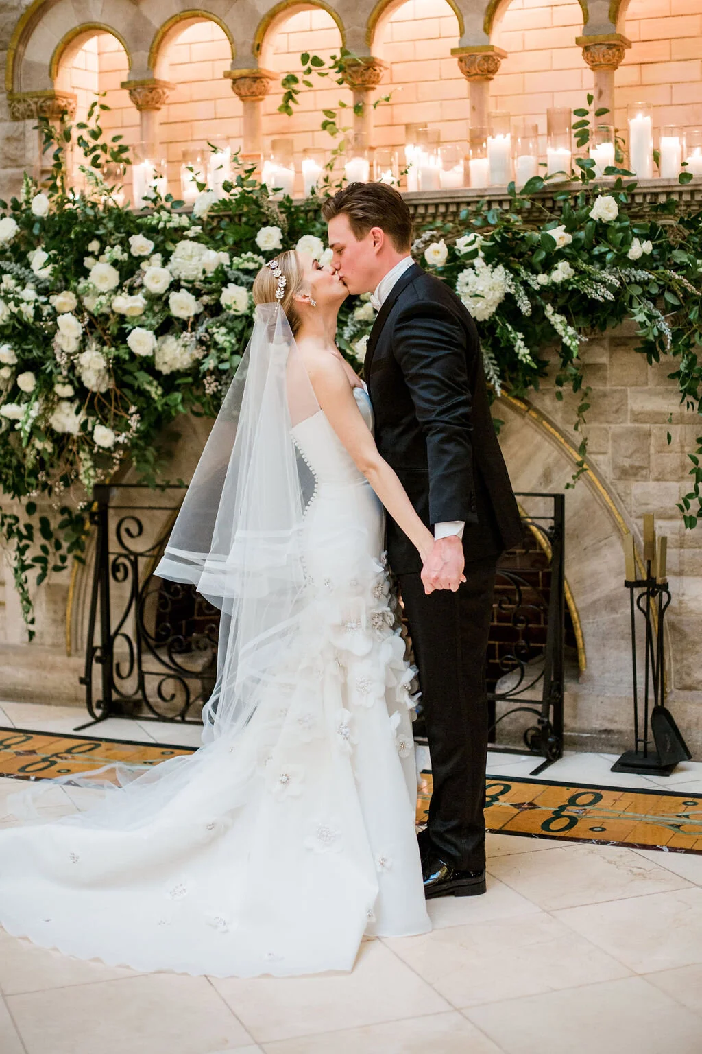 Lush fireplace mantle floral installation with all white garden roses and ranunculus with natural, untamed greenery and eucalyptus. Nashville floral designer, Rosemary & Finch, for a wedding at Union Station.