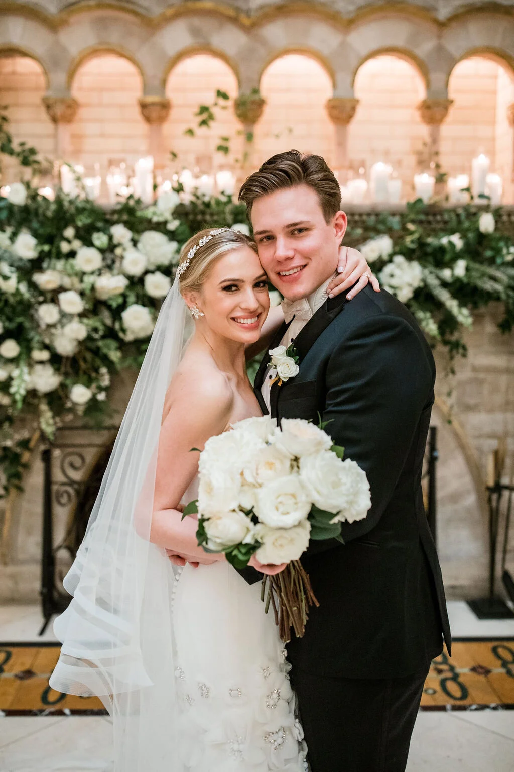 Lush fireplace mantle floral installation with all white garden roses and ranunculus with natural, untamed greenery and eucalyptus. Nashville floral designer, Rosemary & Finch, for a wedding at Union Station.
