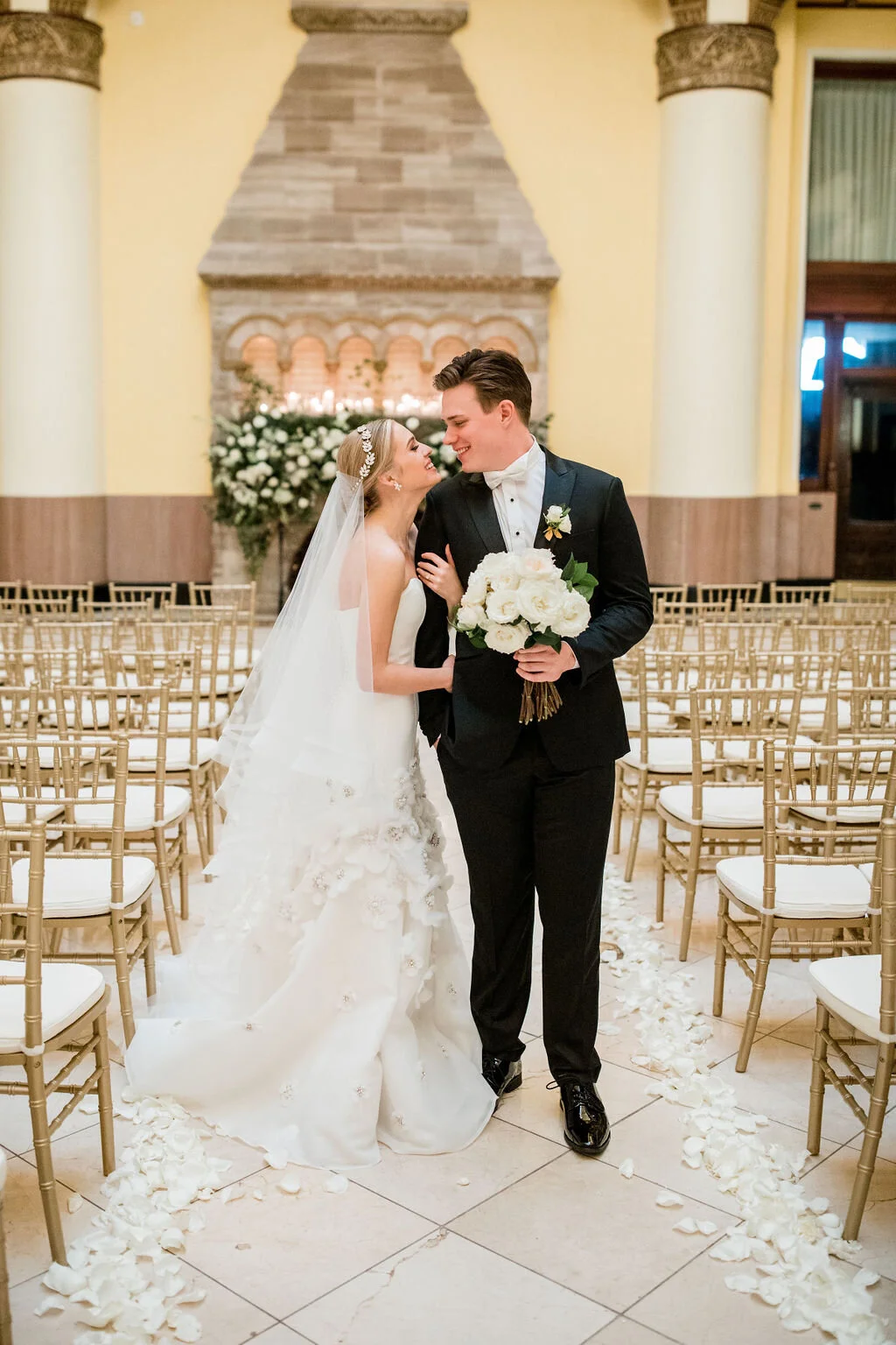 Lush fireplace mantle floral installation with all white garden roses and ranunculus with natural, untamed greenery and eucalyptus. Nashville floral designer, Rosemary & Finch, for a wedding at Union Station.