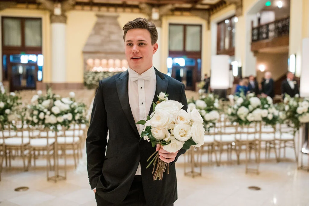 Bridal bouquet of all white garden roses and dark greenery. Nashville wedding flowers by Rosemary & Finch.