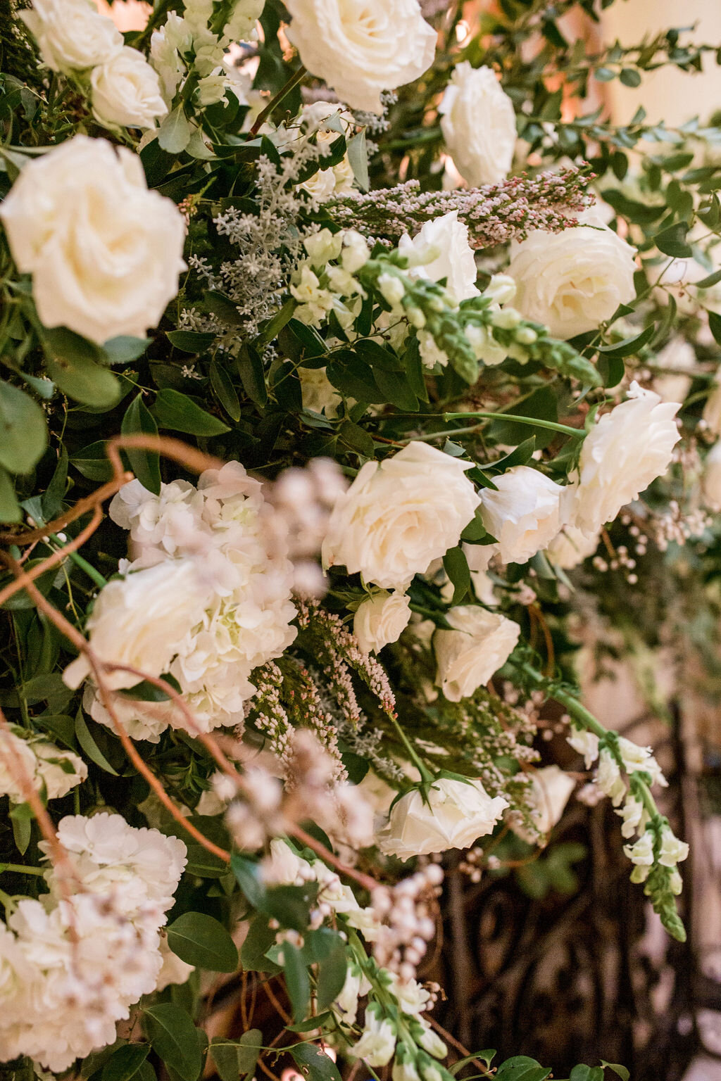 Lush fireplace mantle floral installation with all white garden roses, hydrangeas, and ranunculus with natural, untamed greenery and eucalyptus. Nashville floral designer, Rosemary & Finch, for a wedding at Union Station.