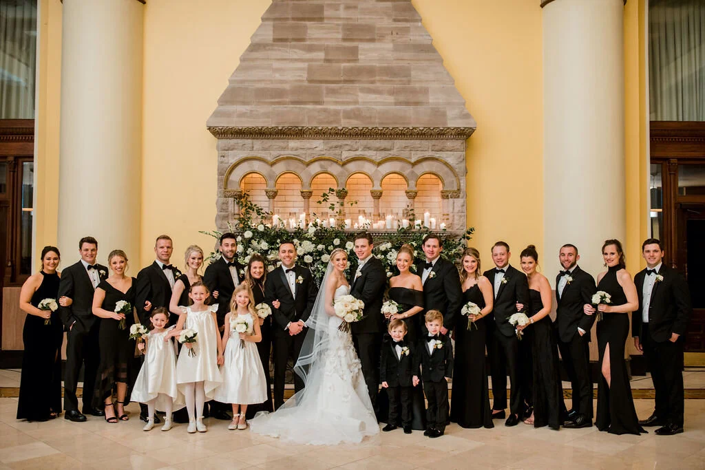 Lush fireplace mantle floral installation with all white garden roses, hydrangeas, and ranunculus with natural, untamed greenery and eucalyptus. Nashville floral designer, Rosemary & Finch, for a wedding at Union Station.
