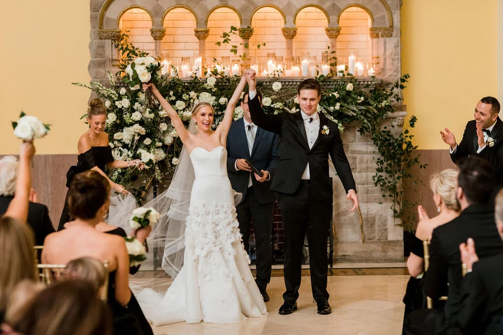 Lush fireplace mantle floral installation with all white garden roses, hydrangeas, and ranunculus with natural, untamed greenery and eucalyptus. Nashville floral designer, Rosemary & Finch, for a wedding at Union Station.