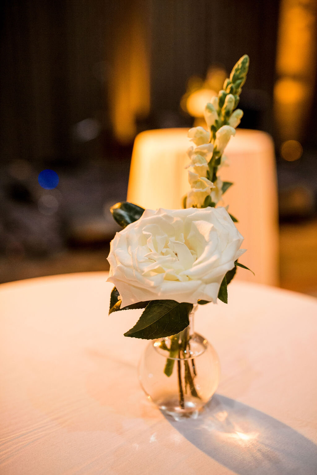 Simple white rose and greenery bud vase. Nashville wedding florist at Union Station.