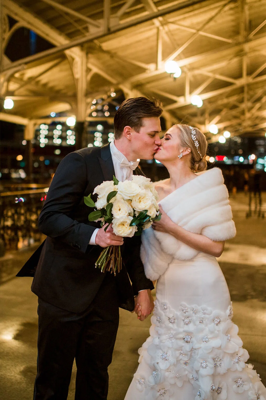 Bridal bouquet of all white garden roses and dark greenery. Nashville wedding flowers by Rosemary & Finch.