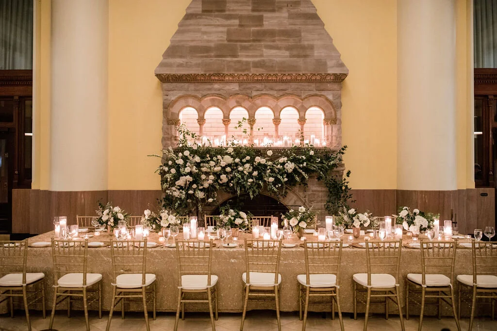 Lush fireplace mantle floral installation with all white garden roses, hydrangeas, and ranunculus with natural, untamed greenery and eucalyptus. Nashville floral designer, Rosemary & Finch, for a wedding at Union Station.