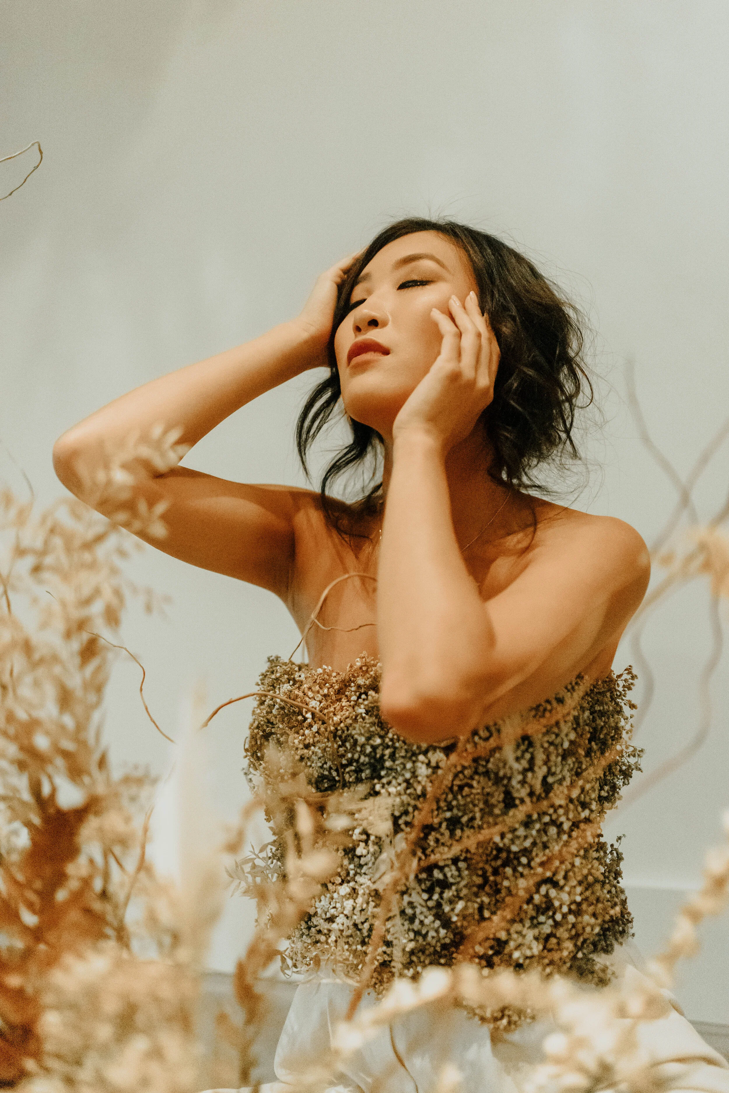 Earth tone floral design with shirt made of flowers - dyed baby’s breath. Nashville wedding florist at the Saint Elle.