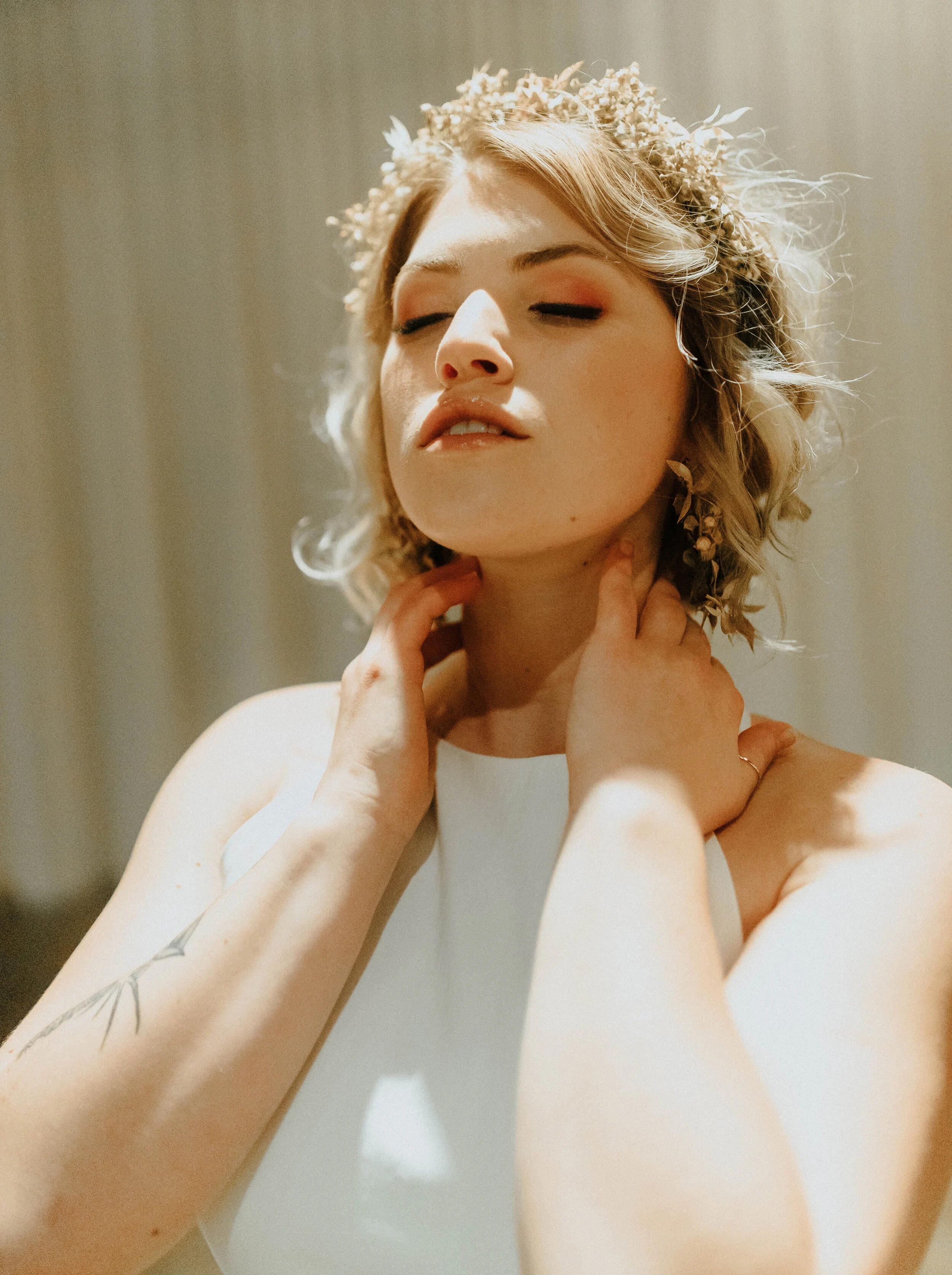 Earthy neutral floral design with flower crown, earrings, and wearable florals. Nashville wedding florist at the Saint Elle.