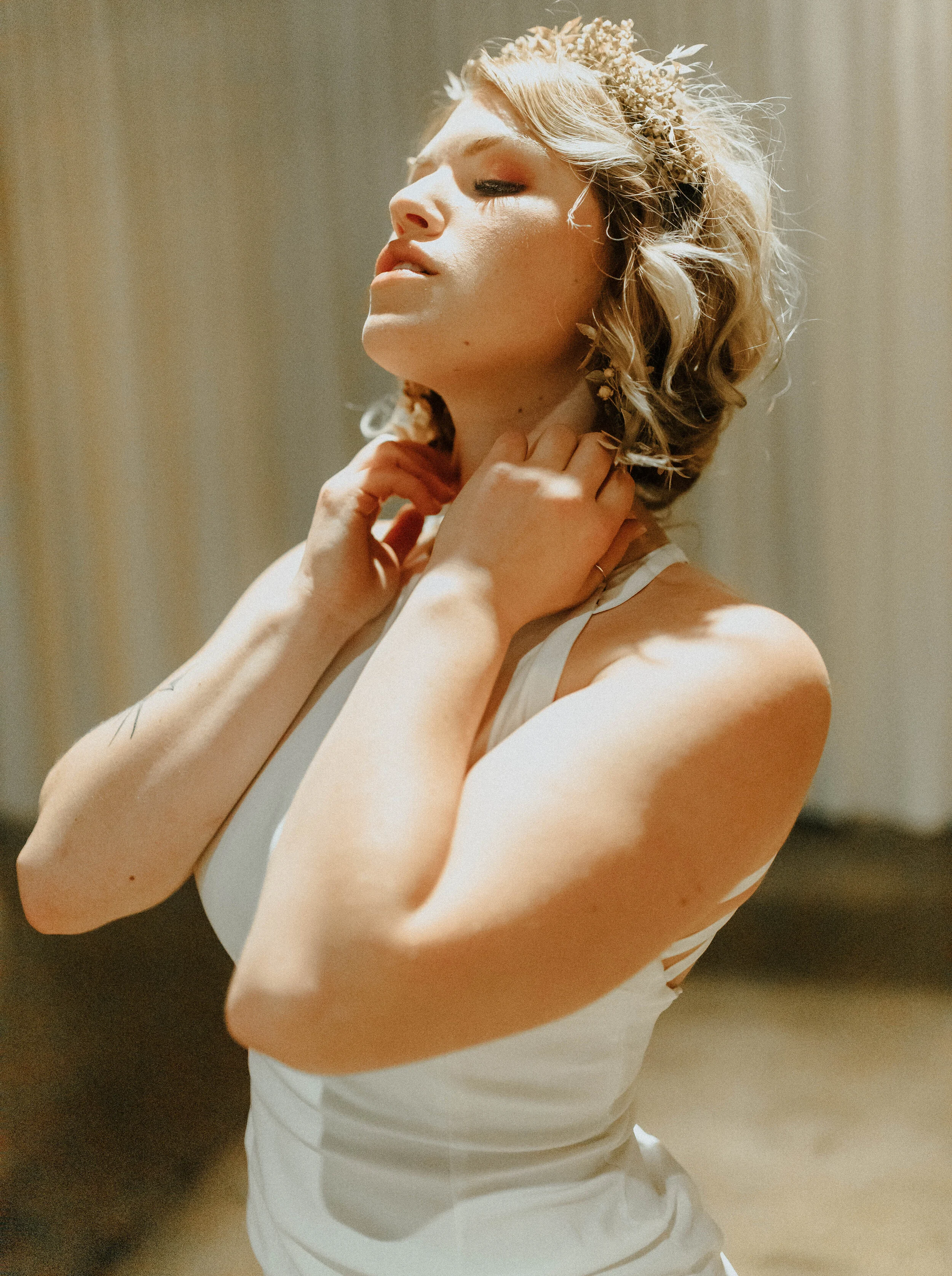 Earthy neutral floral design with flower crown, earrings, and wearable florals. Nashville wedding florist at the Saint Elle.