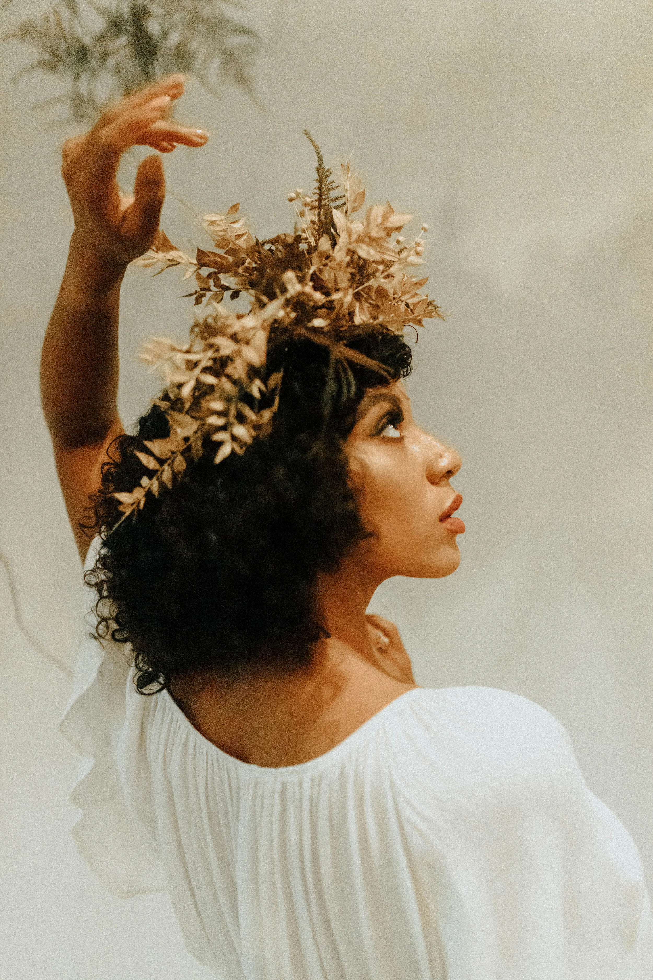Skin tone inspired wearable floral design inspiration shoot. Earth tone hanging flower crown and floral installation at the Saint Elle, Nashville.