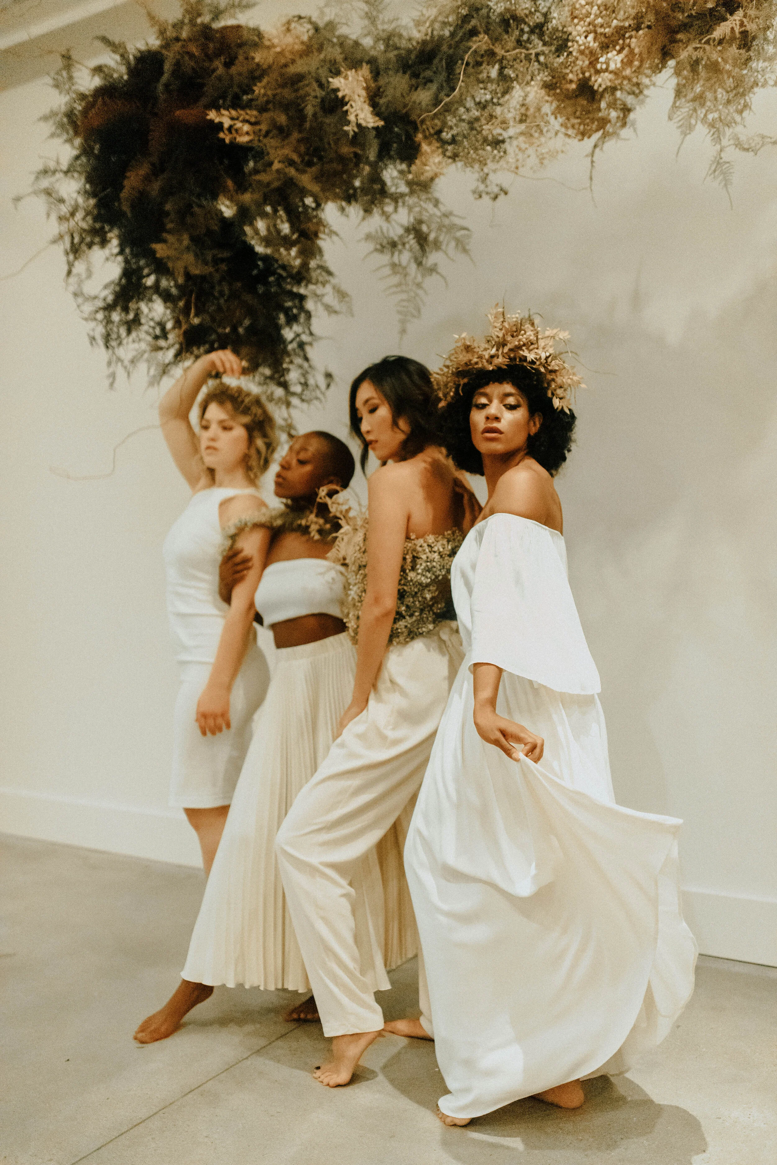 Skin tone inspired wearable floral design inspiration shoot. Earth tone hanging flower installation at the Saint Elle, Nashville.