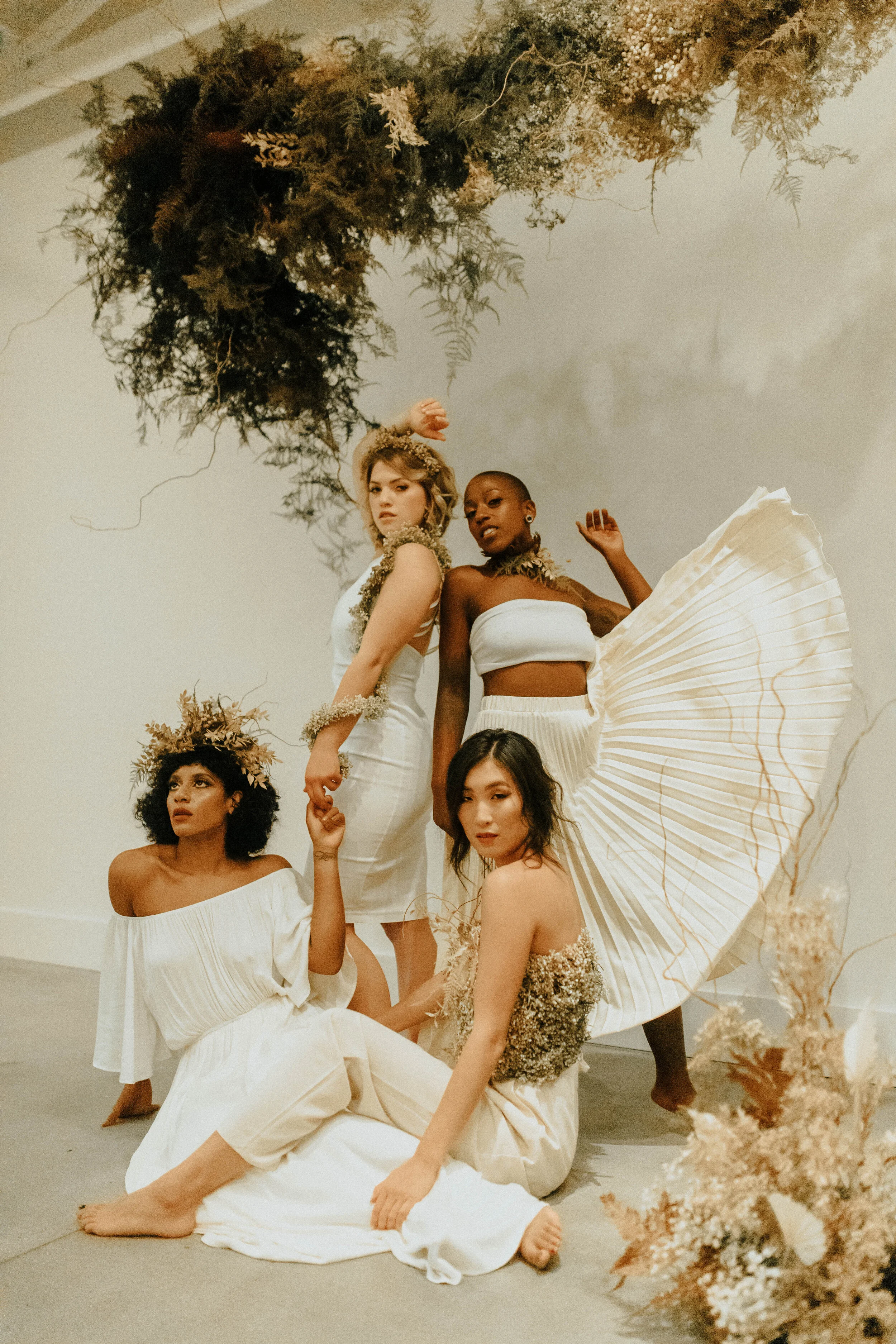 Skin tone inspired wearable floral design inspiration shoot. Earth tone hanging flower installation at the Saint Elle, Nashville.