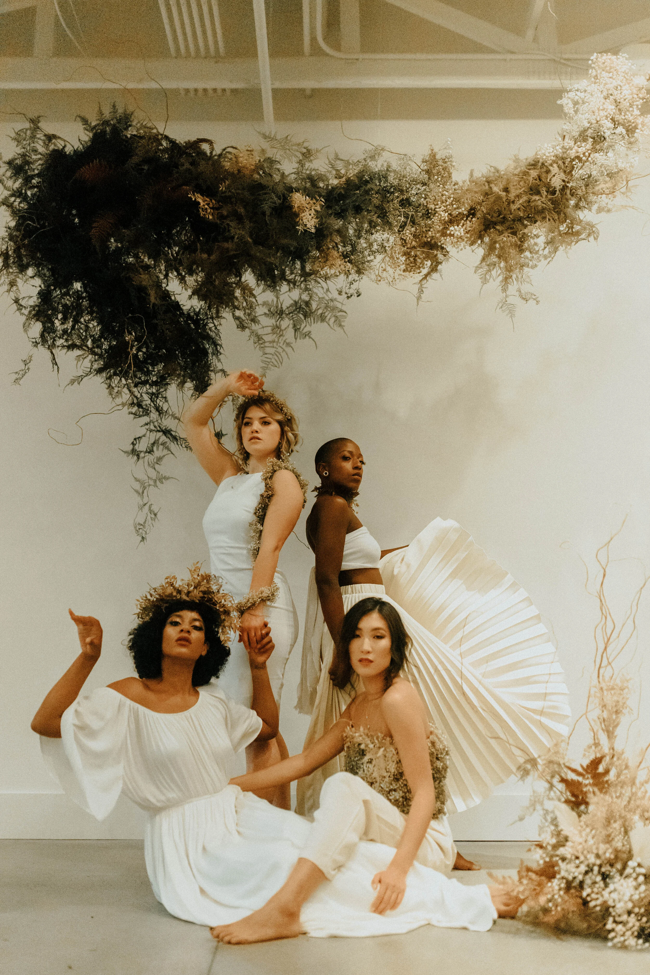 Skin tone inspired wearable floral design inspiration shoot. Earth tone hanging flower installation at the Saint Elle, Nashville.