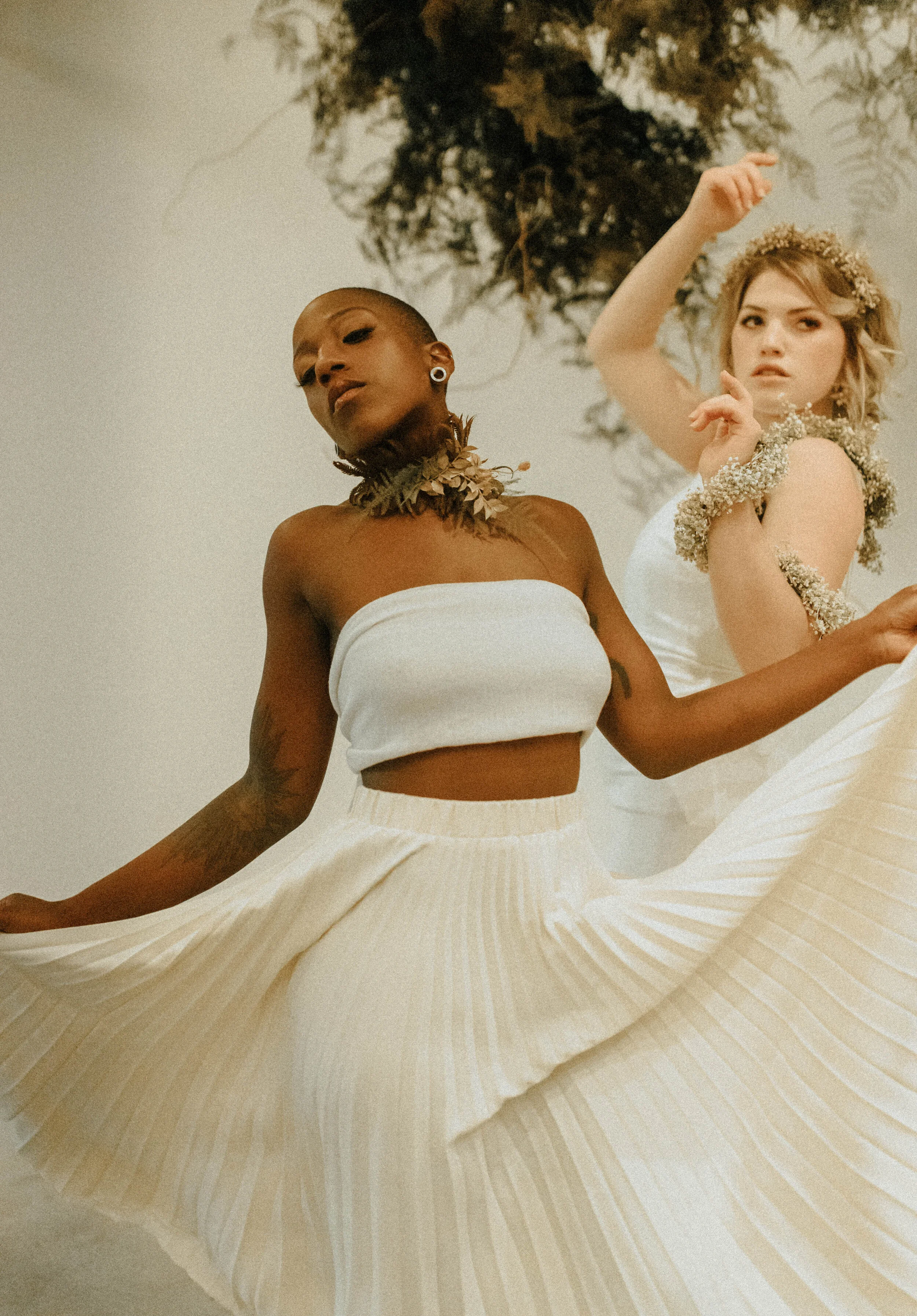 Skin tone inspired wearable floral design inspiration shoot. Earth tone hanging flower installation at the Saint Elle, Nashville.
