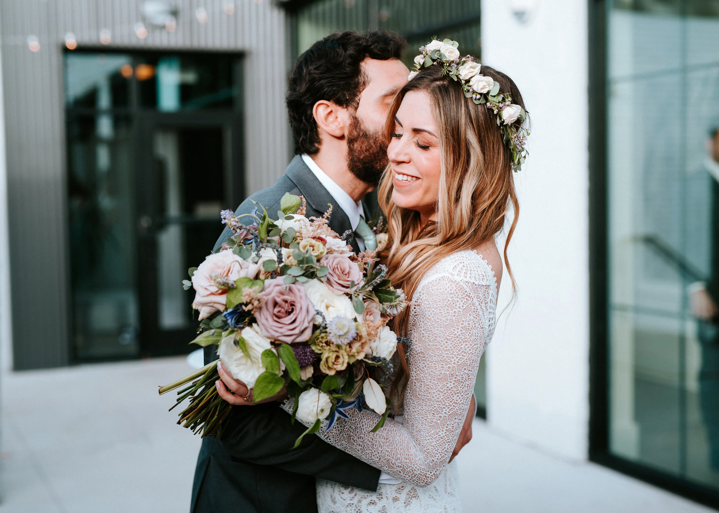 Lavender, mauve, and lilac bridal bouquet with garden roses, ranunculus, astilbe, scabies, clematis, eucalyptus, and greenery. Nashville wedding floral designer at the Saint Elle.