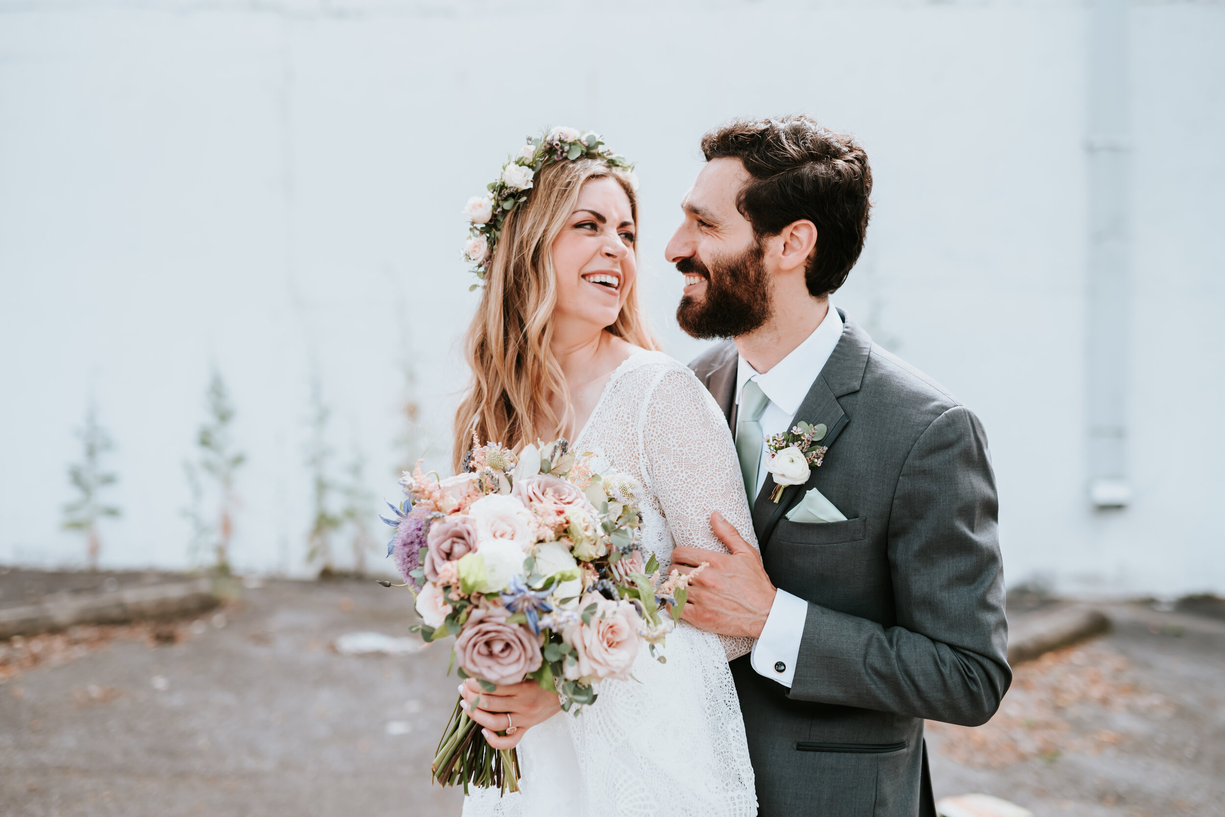 Lavender, mauve, and lilac bridal bouquet with garden roses, ranunculus, astilbe, scabies, clematis, eucalyptus, and greenery. Nashville wedding floral designer at the Saint Elle.