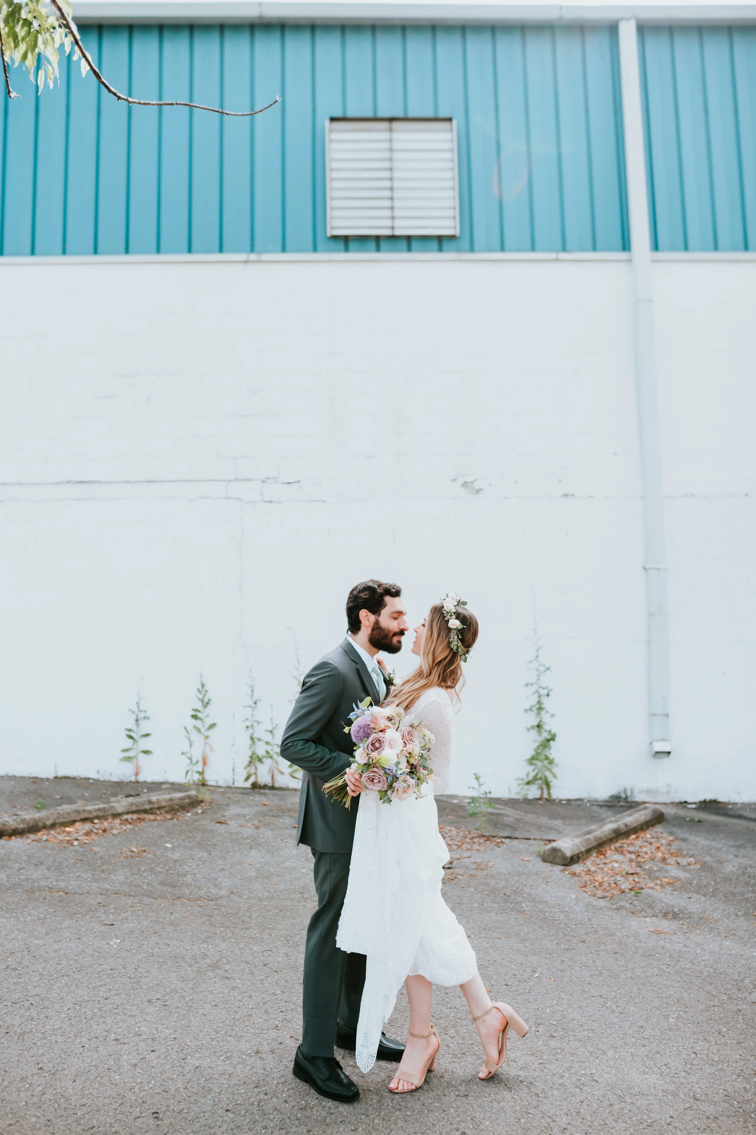 Lavender, mauve, and lilac bridal bouquet with garden roses, ranunculus, astilbe, scabies, clematis, eucalyptus, and greenery. Nashville wedding floral designer at the Saint Elle.