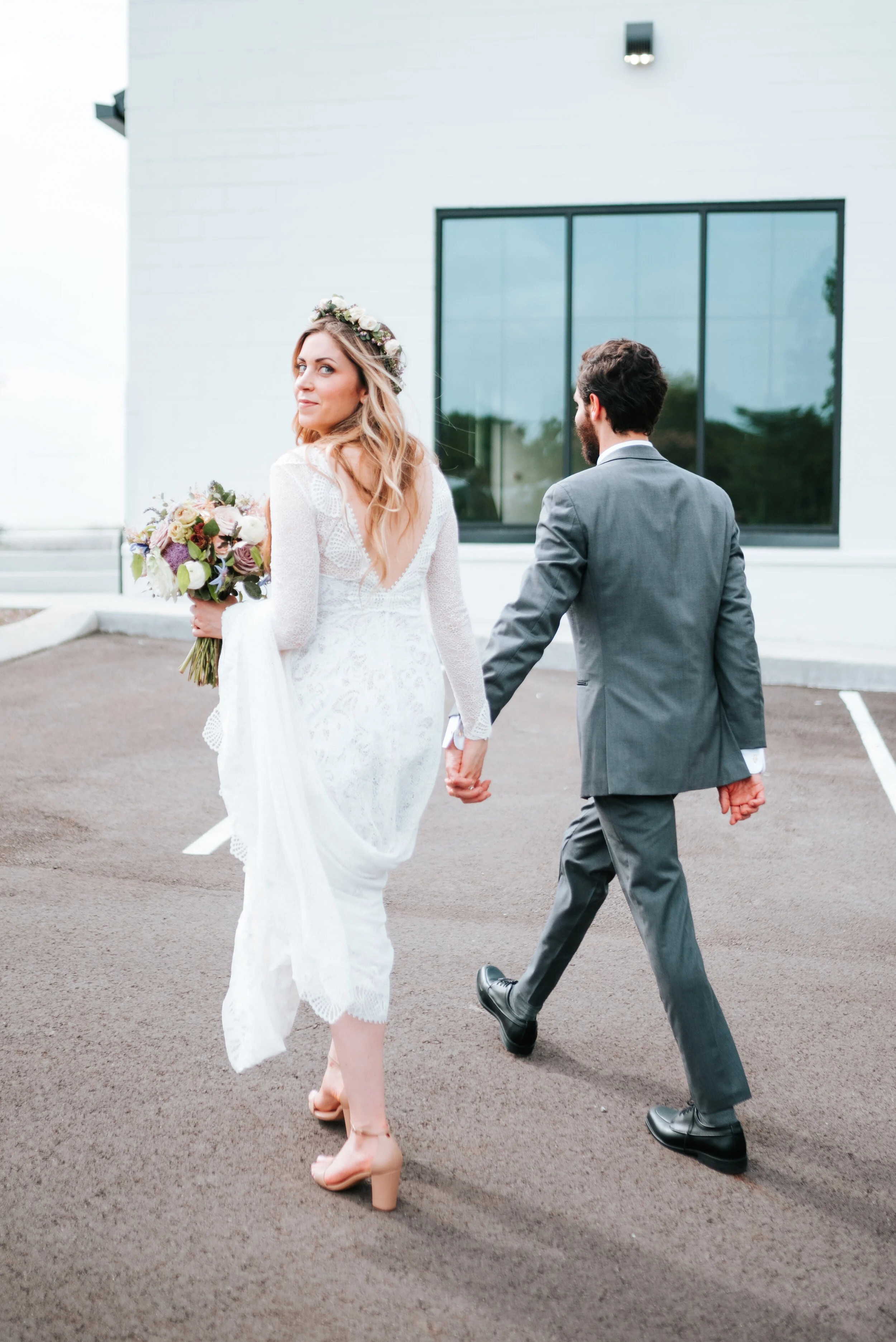 Lavender, mauve, and lilac bridal bouquet with garden roses, ranunculus, astilbe, scabies, clematis, eucalyptus, and greenery. Nashville wedding floral designer at the Saint Elle.