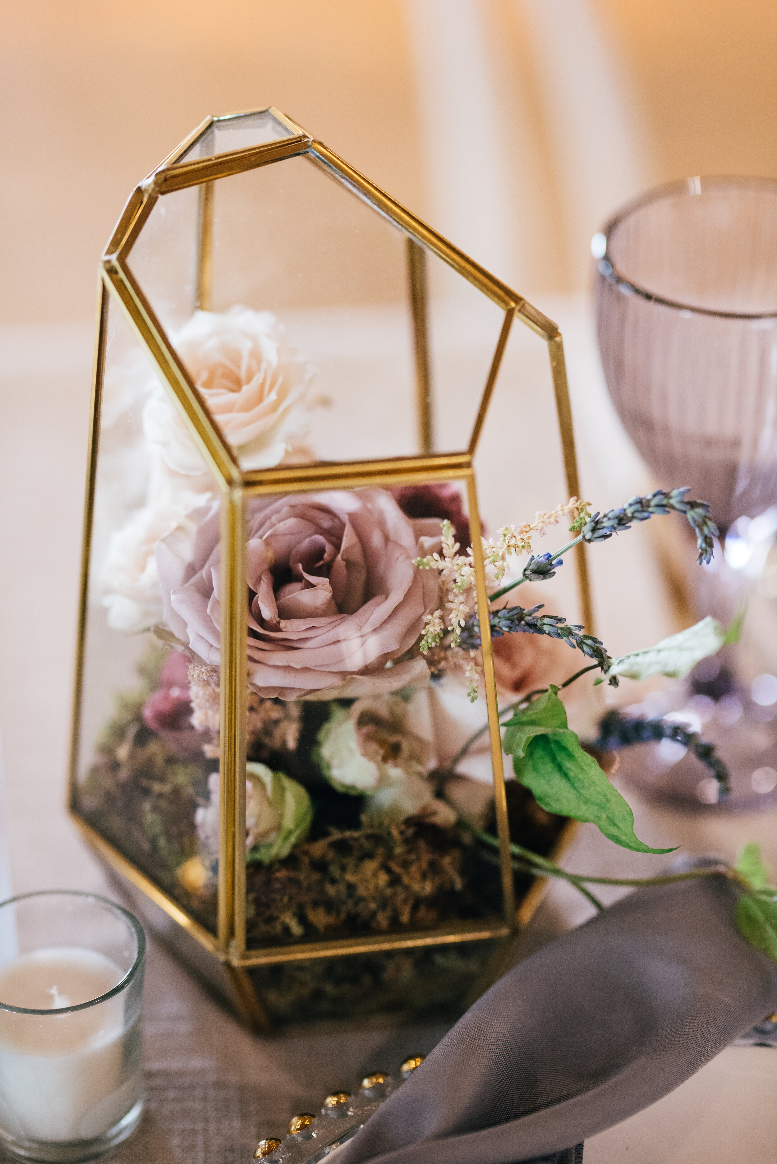 Gold geometric terrarium centerpieces with eucalyptus and lavender florals. Nashville wedding florist at the Saint Elle.