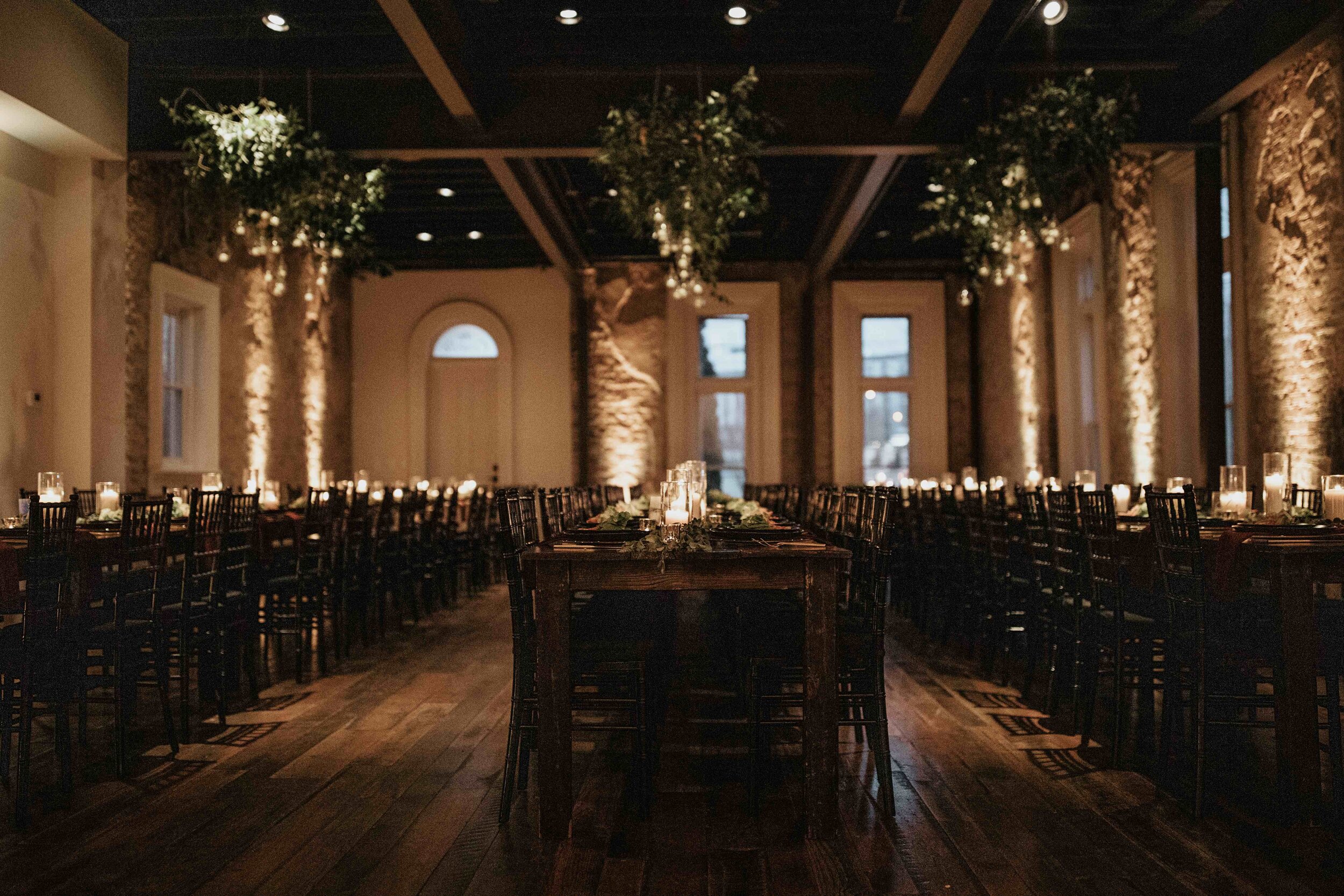 Hanging terrarium candle installation with lush greenery. Nashville wedding floral design at the Cordelle.