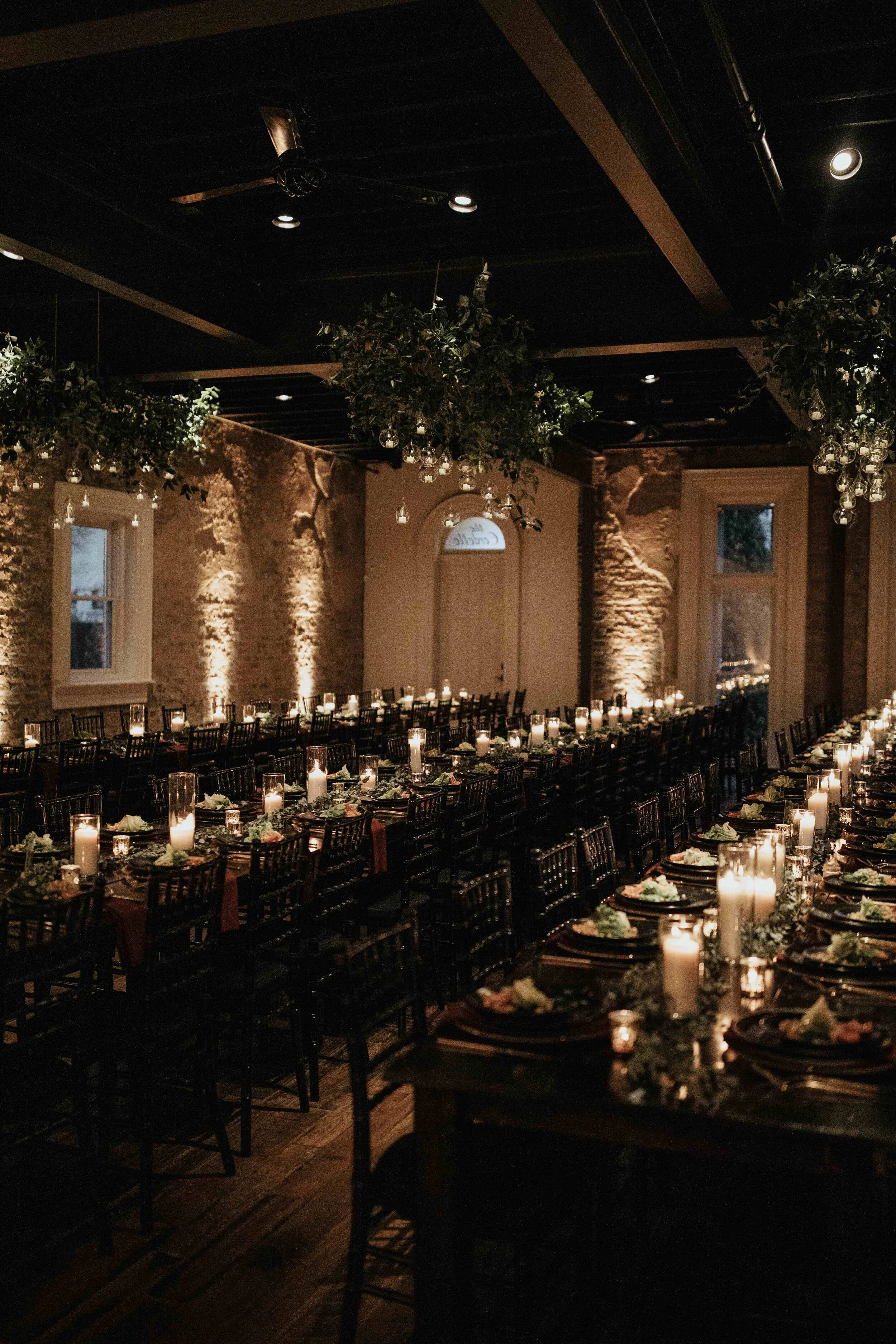 Hanging terrarium candle installation with lush greenery. Nashville wedding floral design at the Cordelle.