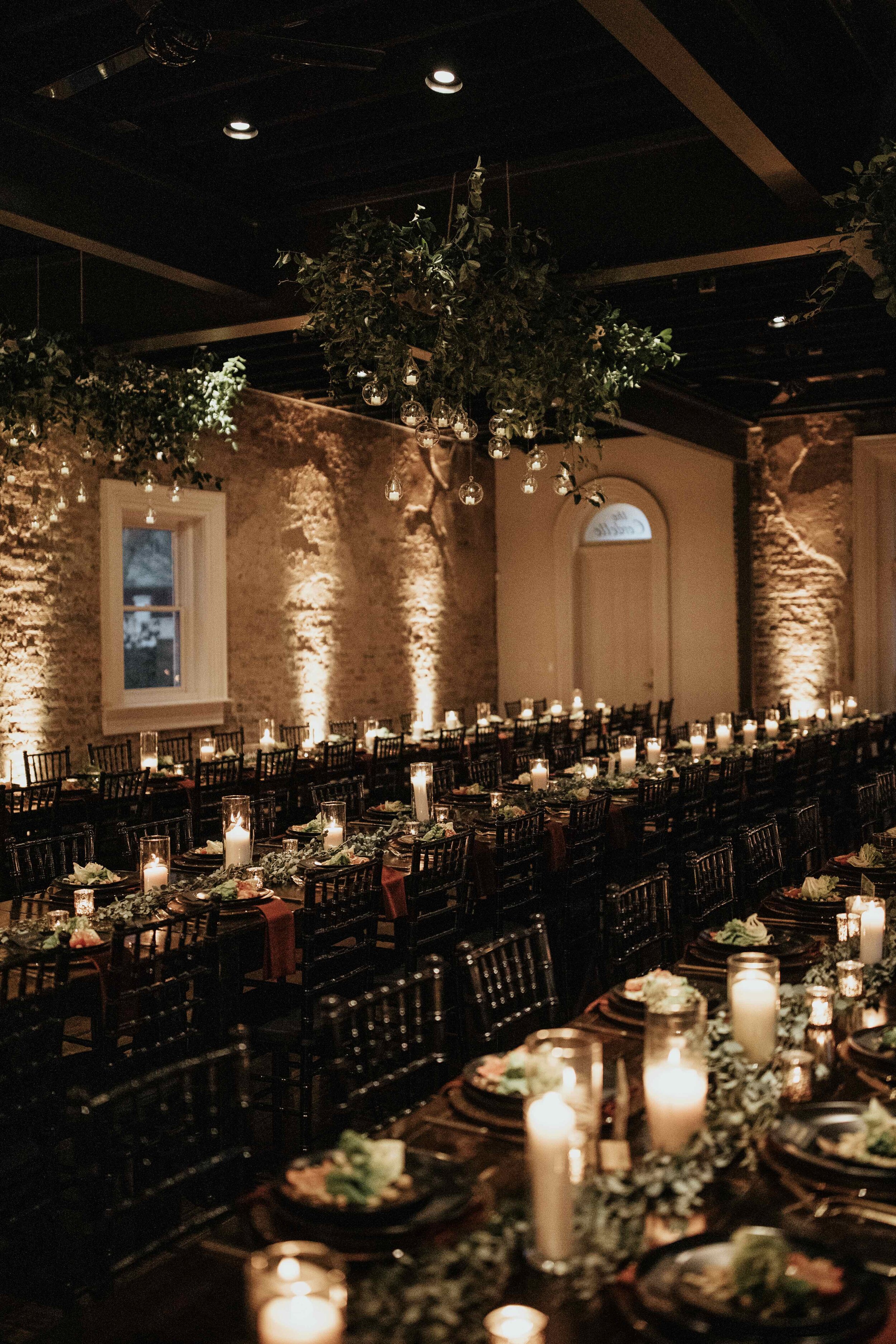 Hanging terrarium candle installation with lush greenery. Nashville wedding floral design at the Cordelle.