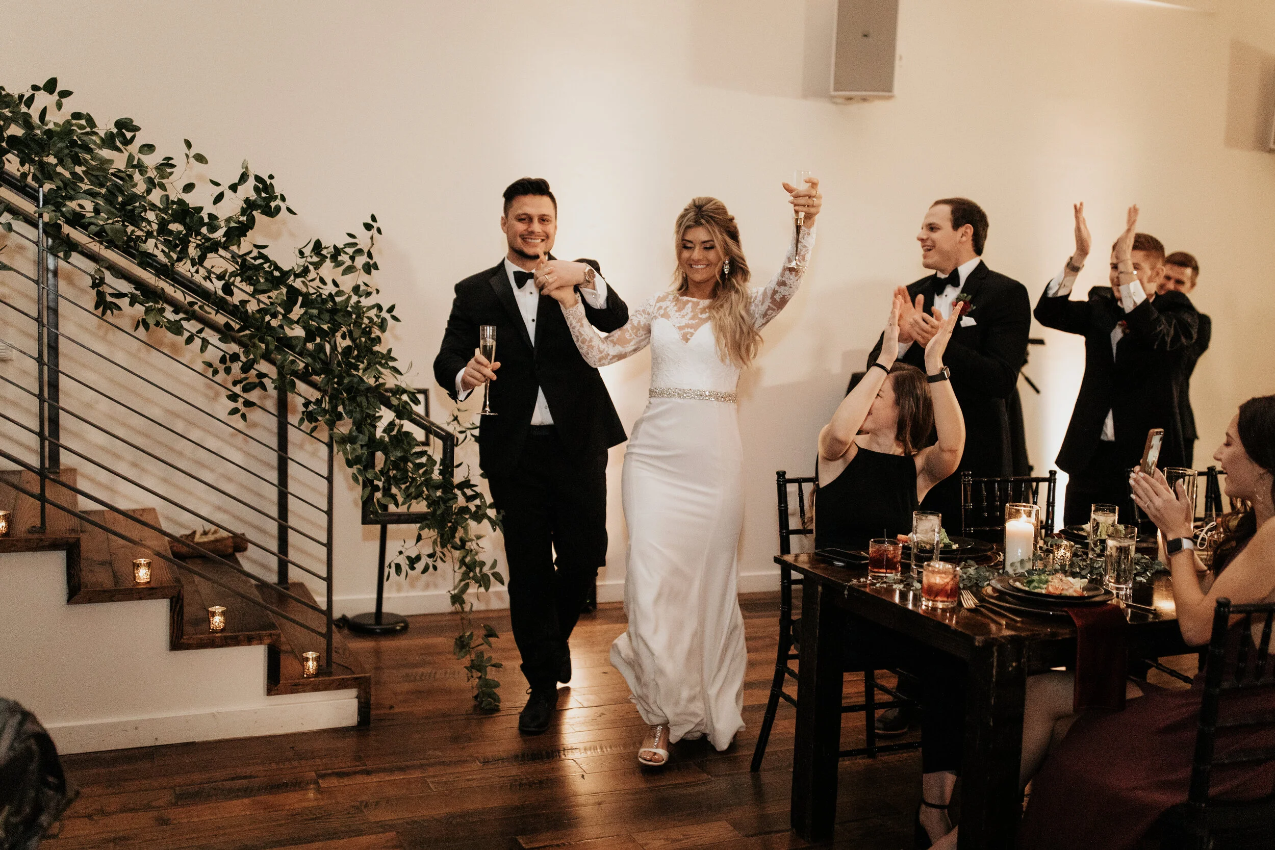 Greenery growing up the bannister in the Cordelle. Nashville wedding florist.