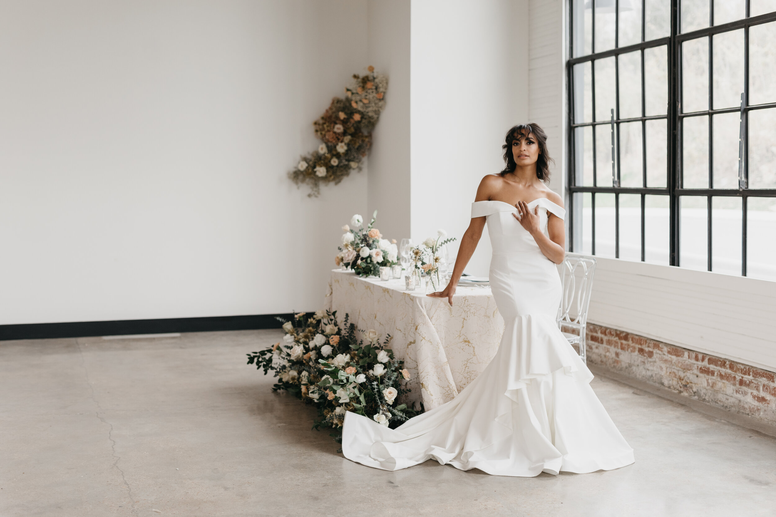 Wintery growing floor installation and tablescape featuring white and quicksand roses, touches of gold, baby eucalyptus and lush greenery. Nashville wedding florist Rosemary & Finch at OZARI.