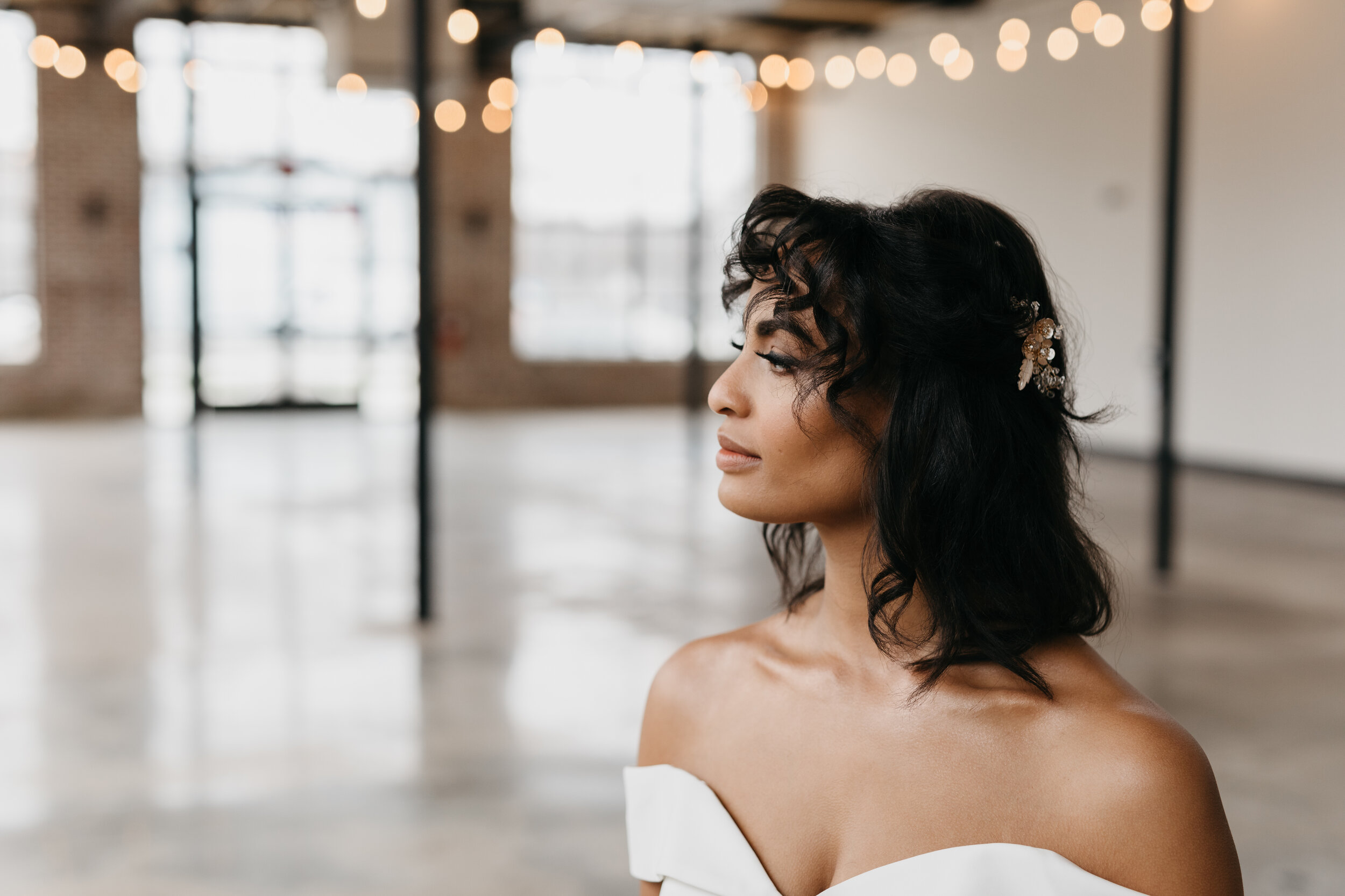Wintery growing floor installation and tablescape featuring white and quicksand roses, touches of gold, baby eucalyptus and lush greenery. Nashville wedding florist Rosemary & Finch at OZARI.