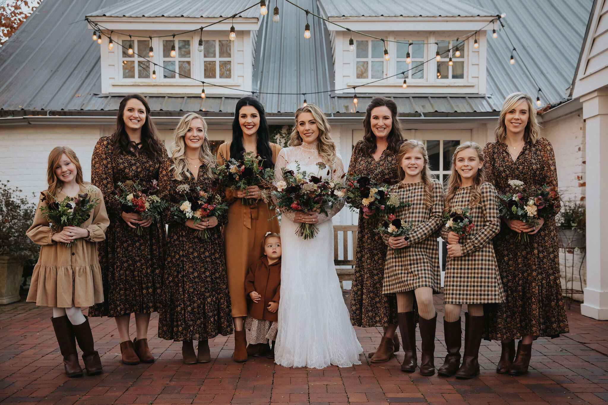 Romantic and earthy bridesmaid's bouquets filled Chocolate Cosmos, Queen Ann's Lace, Baby Eucalyptus, Rust Bunny Tails, Festival Bush, Antique Carnations, Burgundy Ranunculus, and Brown Lisianthus. Designed by Nashville wedding floral designer, Rose…